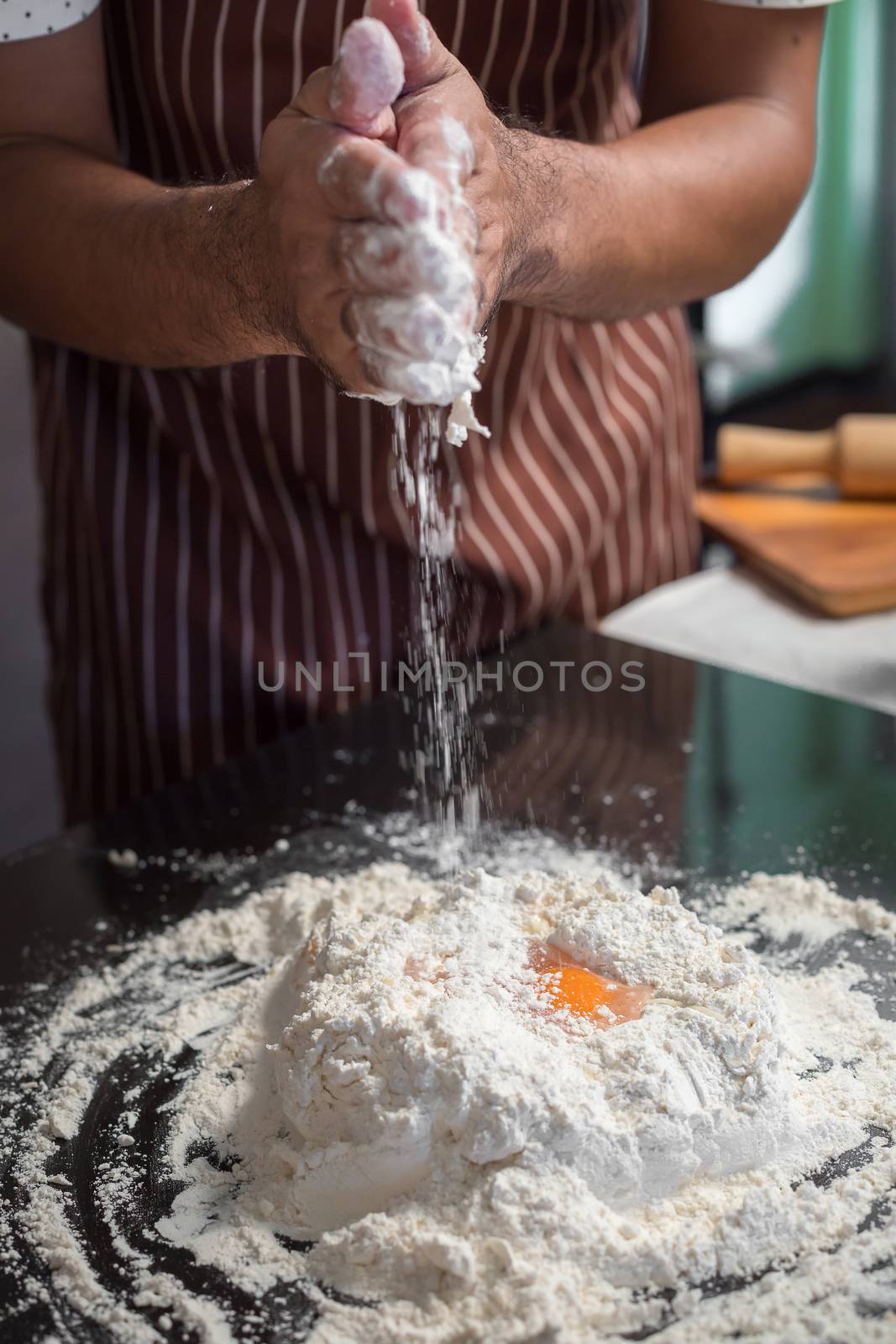 Chef hipster stylish hand mixing egg yolk, sugar and flour To ma by kaiskynet