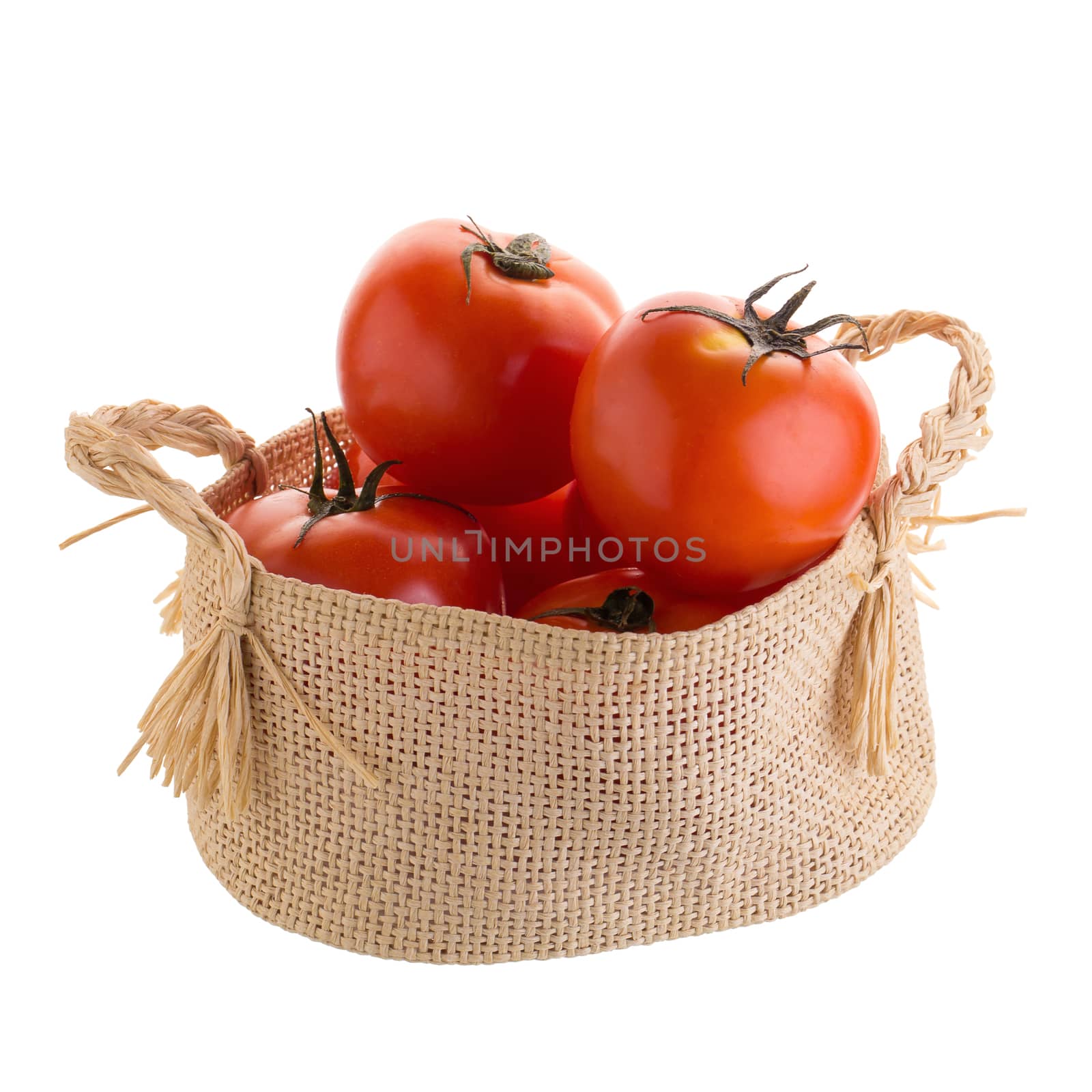 Tomato In the basket isolated on a white background.