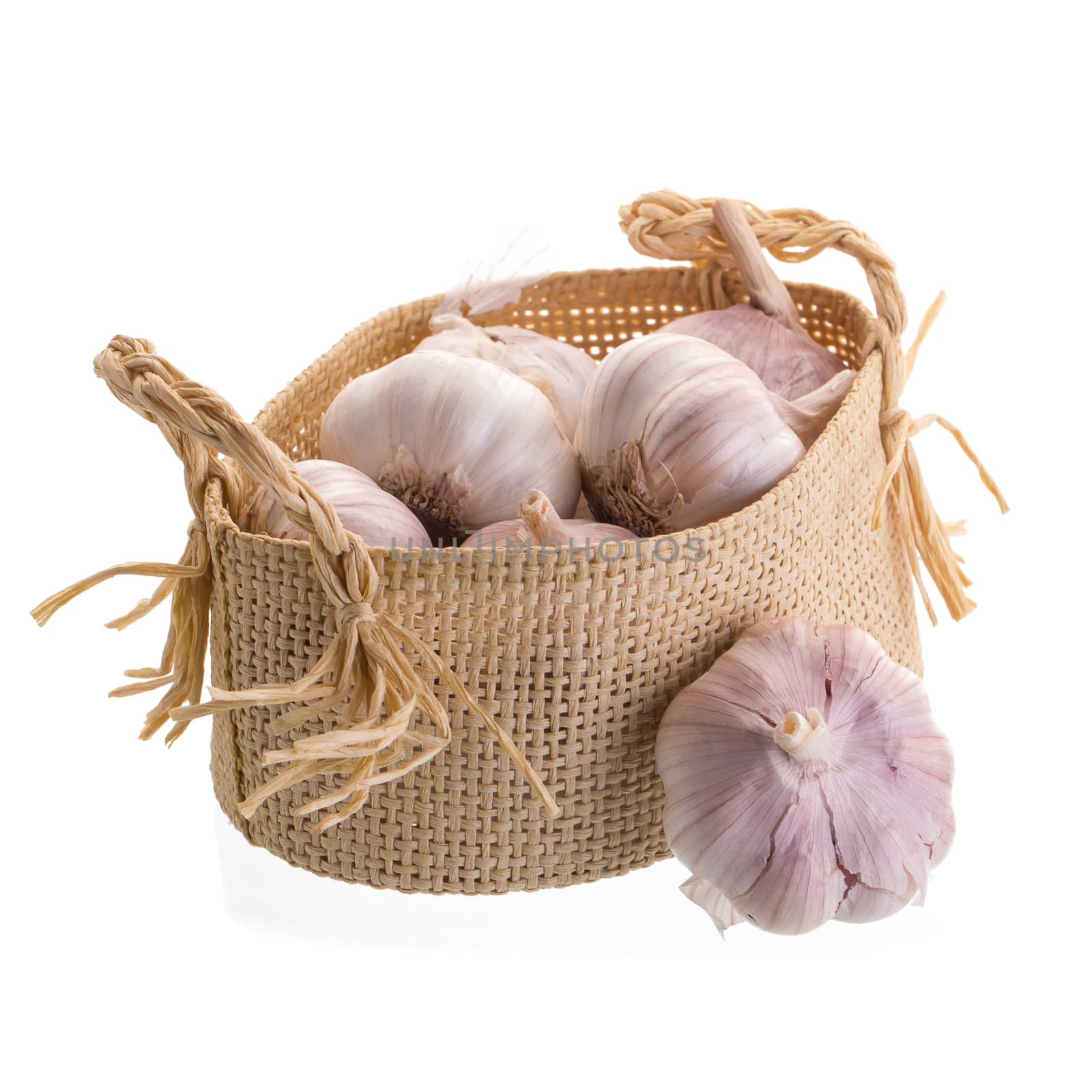 Garlic In the basket isolated on a white background by kaiskynet