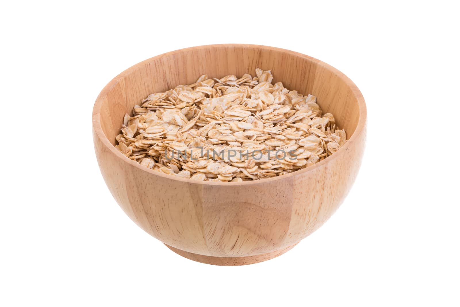 Oat flakes in a wooden bowl on a white background