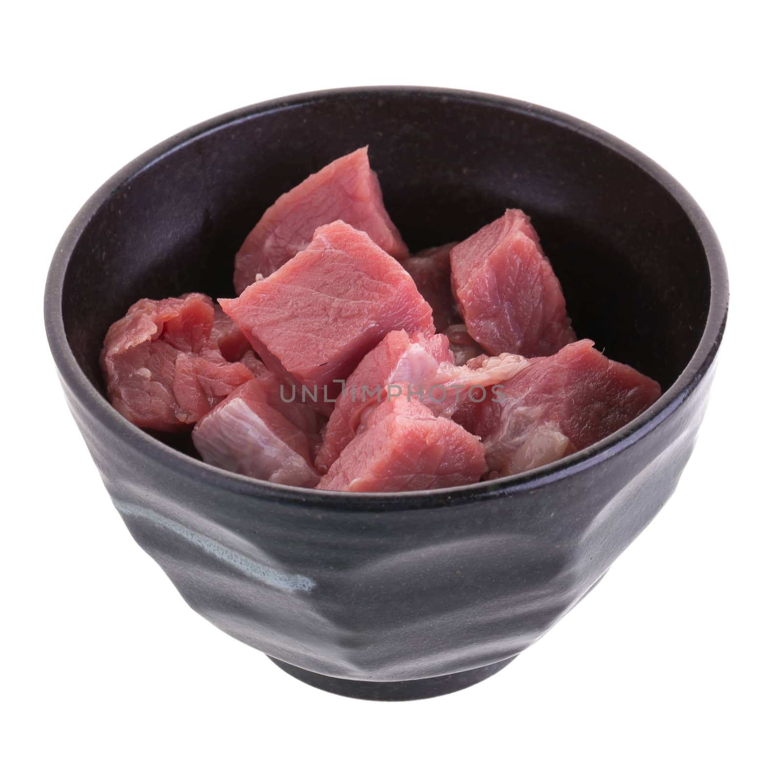 fresh raw beef cubes in black bowl isolated on white background by kaiskynet