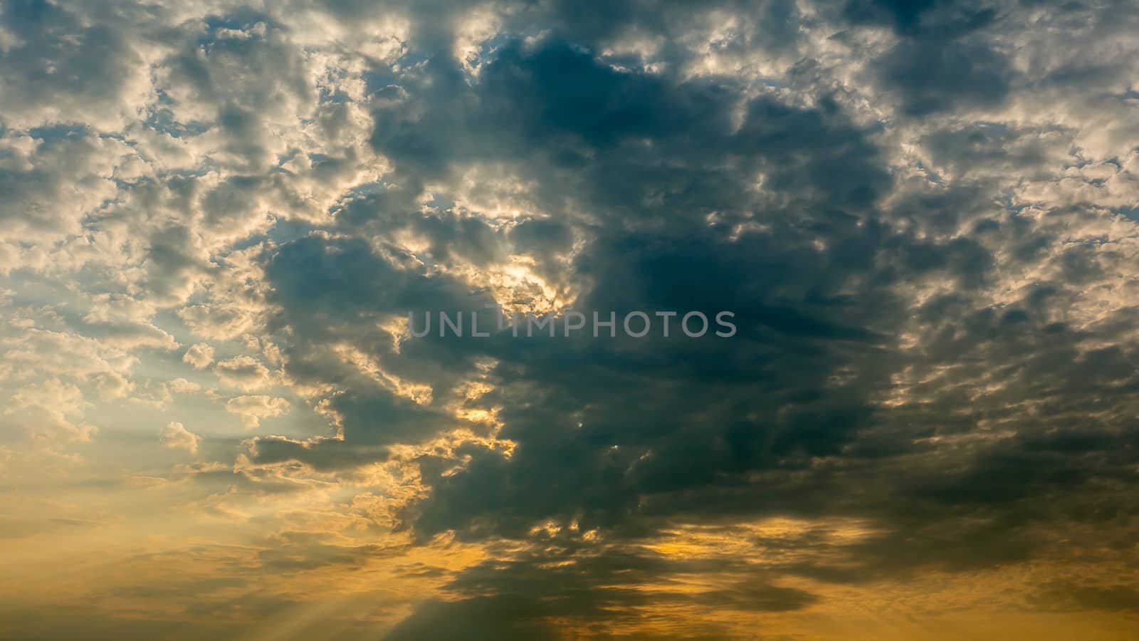 Colorful dramatic sky with cloud at Sunrise.Sky with sun background.