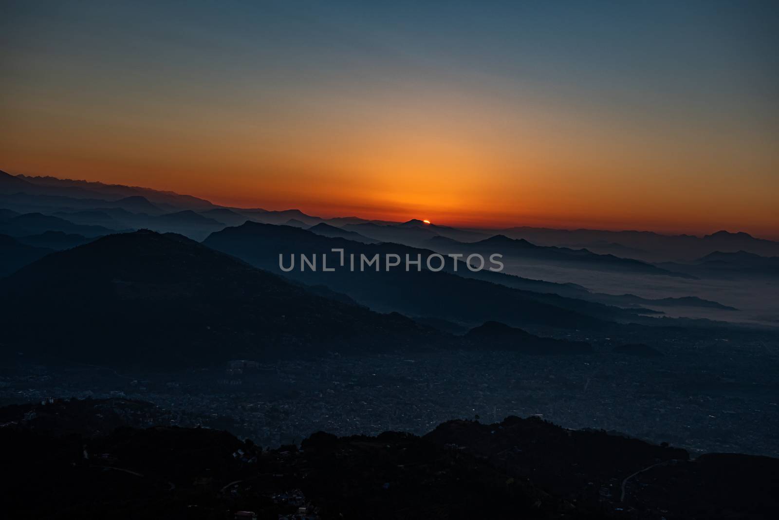 Pokhara sunrise at Sarangkot Hill with view of Himalayan mountain range. by rayints