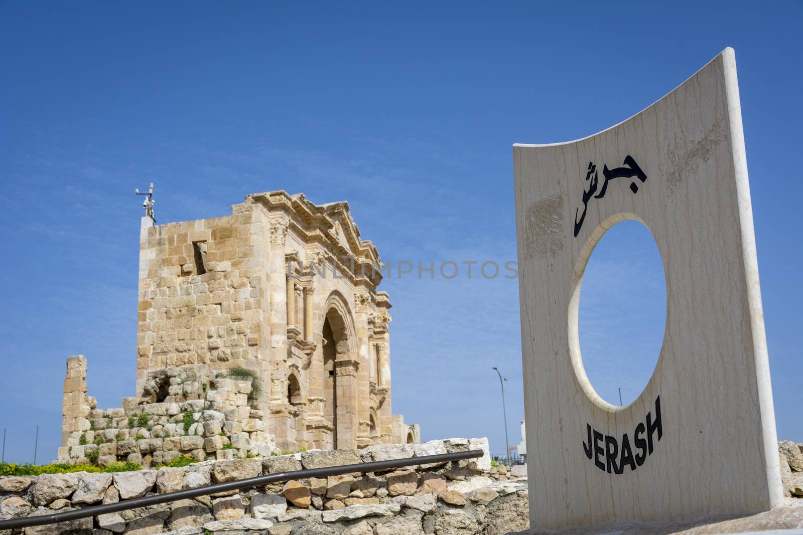 Gerasa, Jerash, Jordan: entrance of the historical roman ruins site of Gerasa in Jerash, Jordan, with the Arch of Hadrian in the background