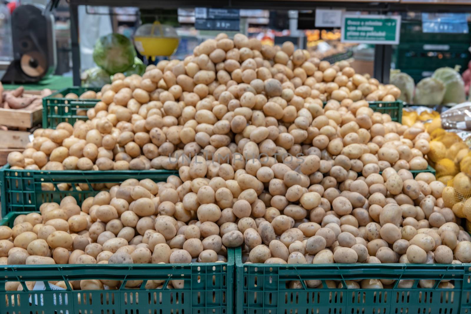 Fresh vegetables on supermarket shelves and in markets in crates from farmers