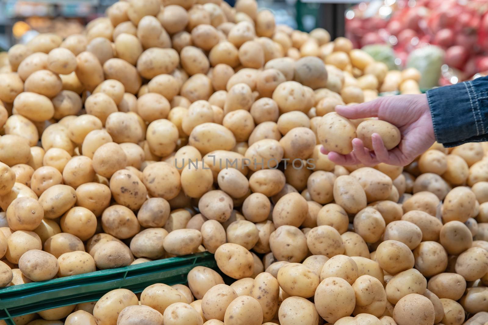 Fresh vegetables on supermarket shelves and in markets in crates from farmers