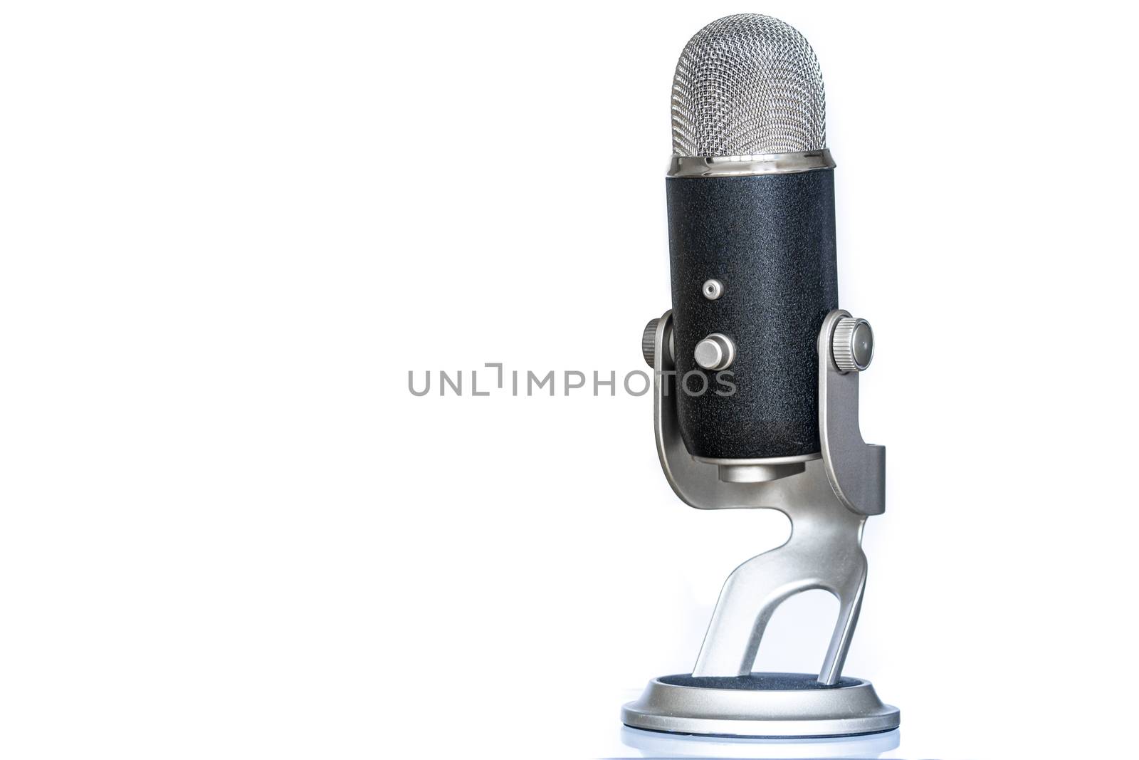 Microphone with classic and vintage look standing up. Used for podcasting or other voice recording. by kb79