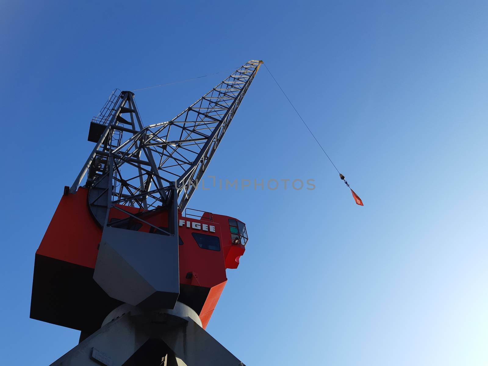 Rotterdam, Netherlands, September 2019: view on the historical red Figee harbor crane in Leuvehaven, Rotterdam
