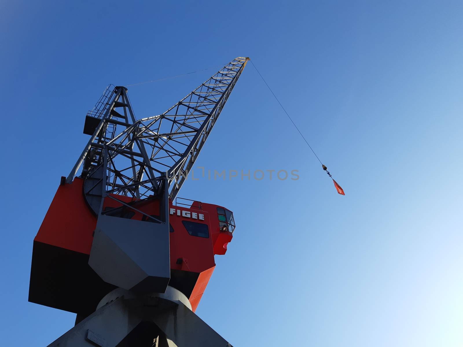 View on the historical red Figee harbor crane in Leuvehaven, Rotterdam by kb79