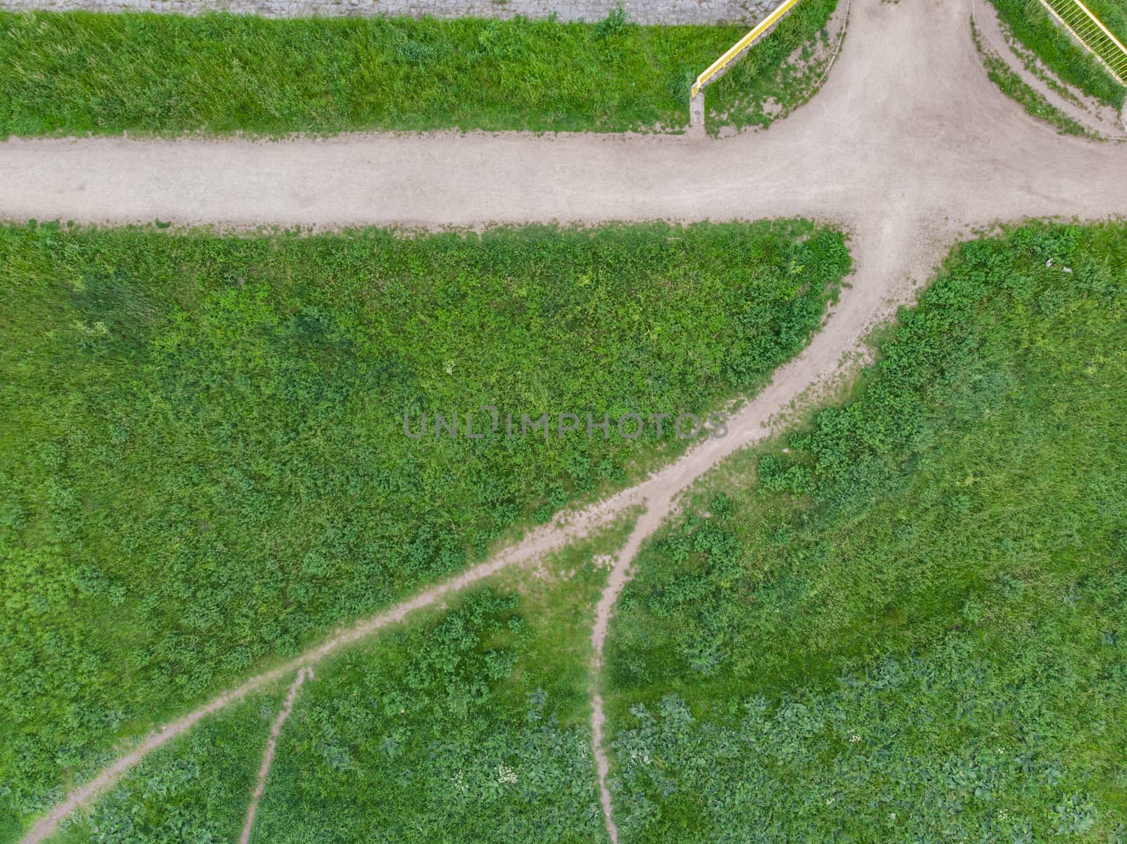 Top down look to connection of paths between grass and bushes by Wierzchu
