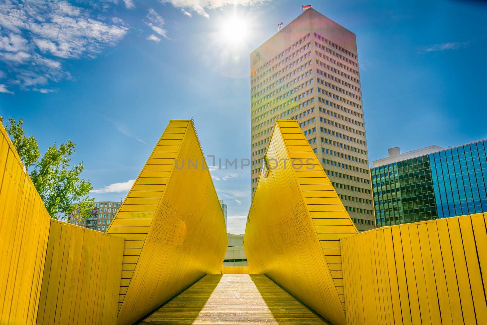 Rotterdam, Netherlands, September 2019: view on the Luchtsingel, a crowdfunded elevated wooden yellow foot bridge, connecting park pompenburg, hofplein and dakakker