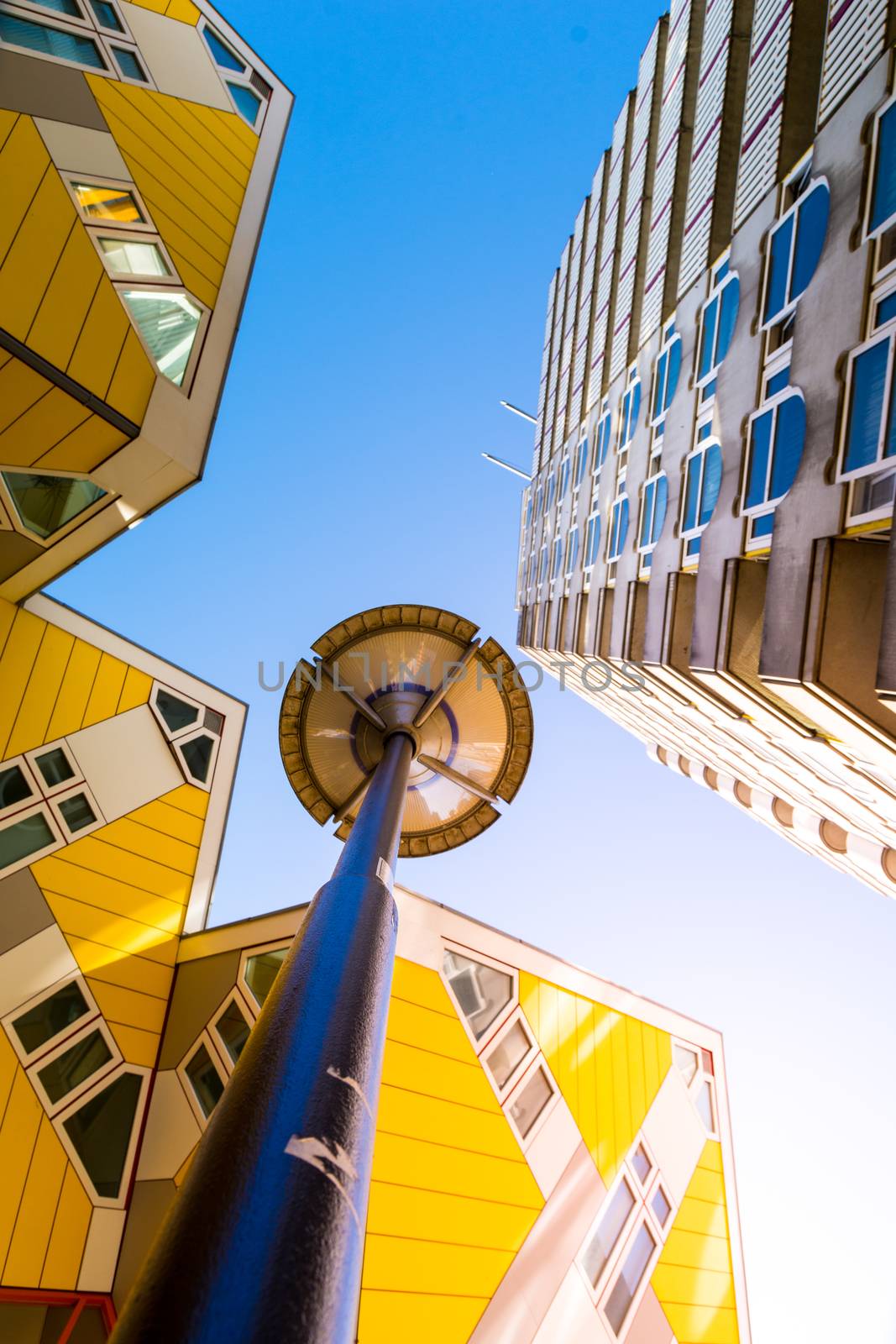 Low angle view of the Cube houses (Kubuswoningen) and Blaaktoren (Het Potlood) architecture, both designed by architect Piet Blom