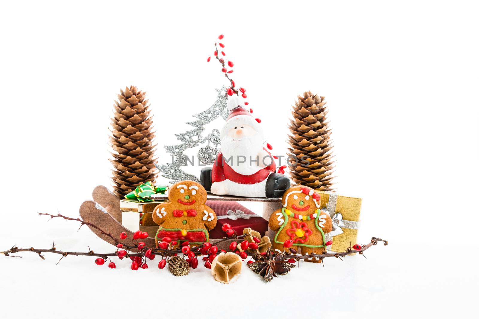 Close up of Santa sitting on wooden horse sledge holding gift and presents - white and red christmas background