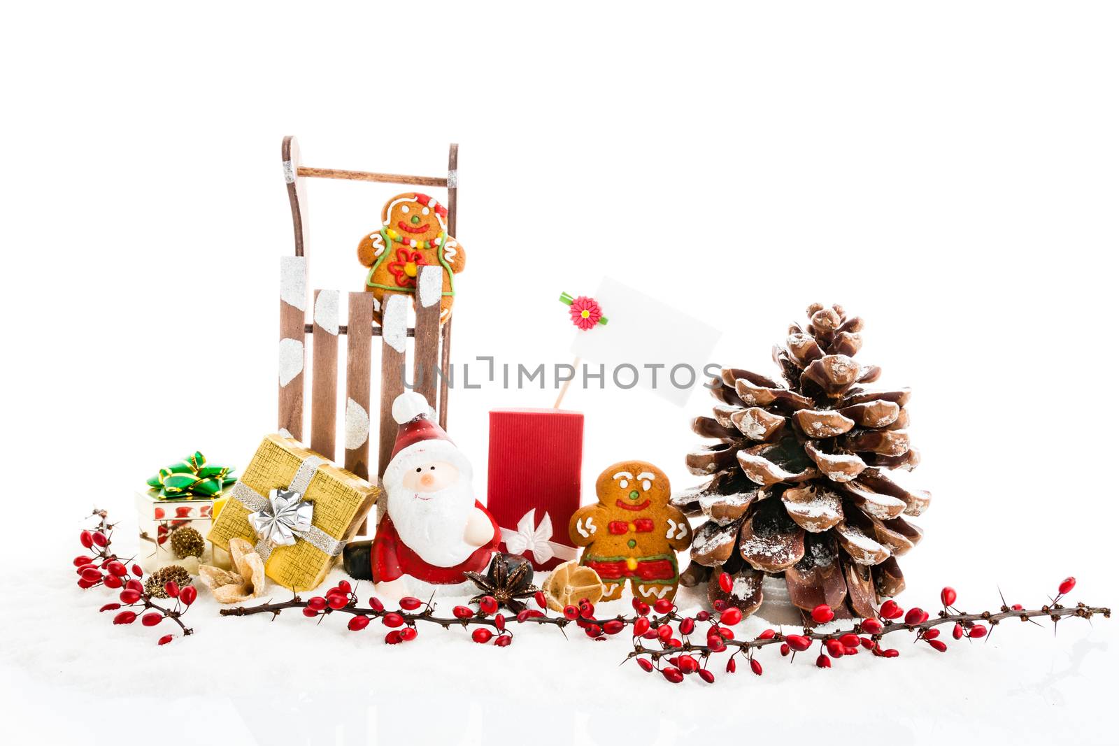 Close up of Santa sitting on wooden horse sledge holding gift an by claraveritas