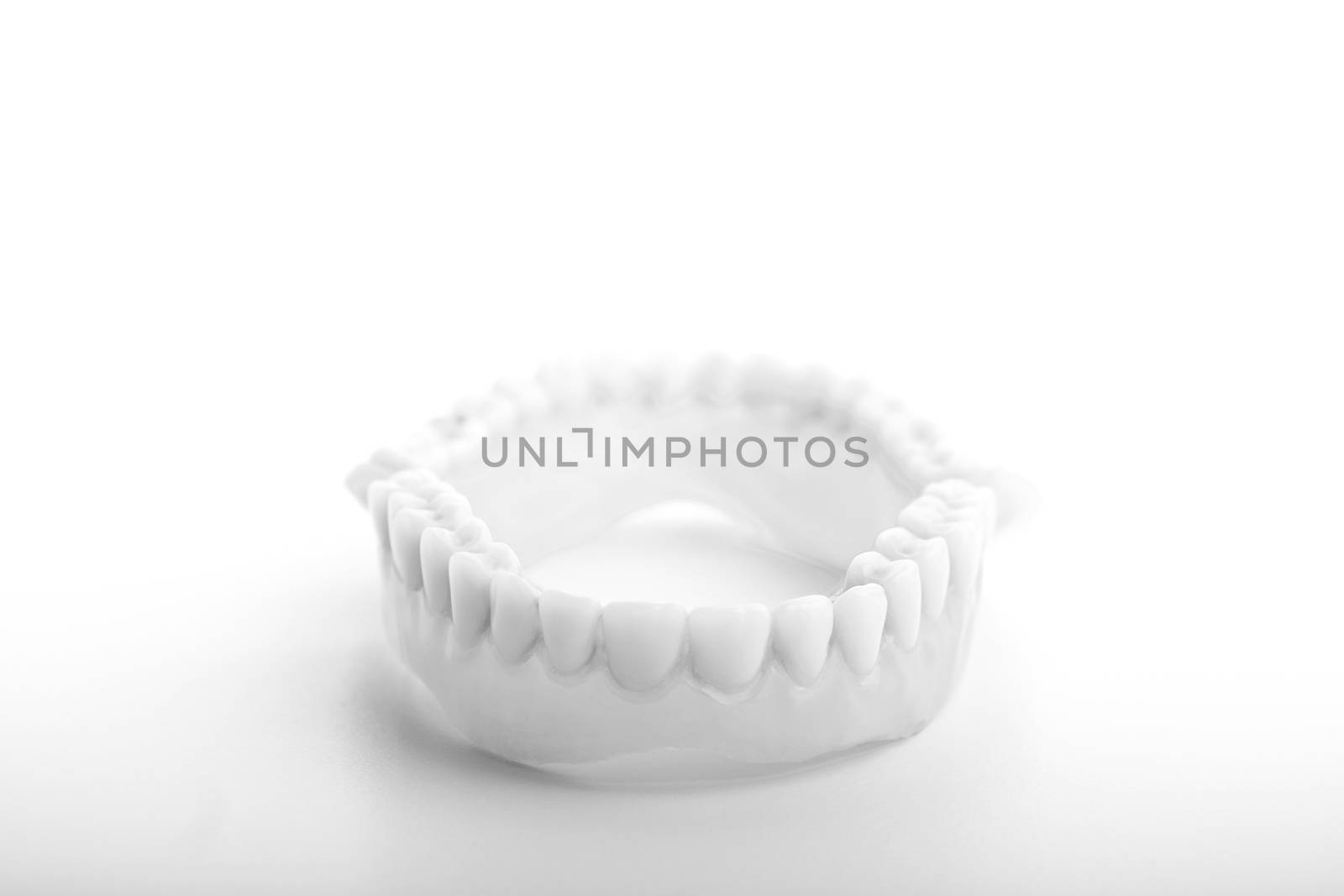grey medical denture smile jaws teeth on white background 