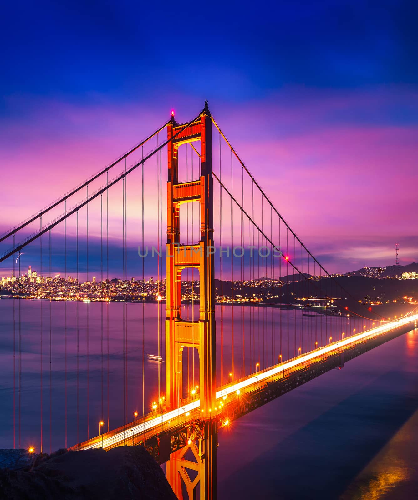 Famous Golden Gate Bridge in San Francisco at night seen from Battery Spencer viewpoint. Long exposure.