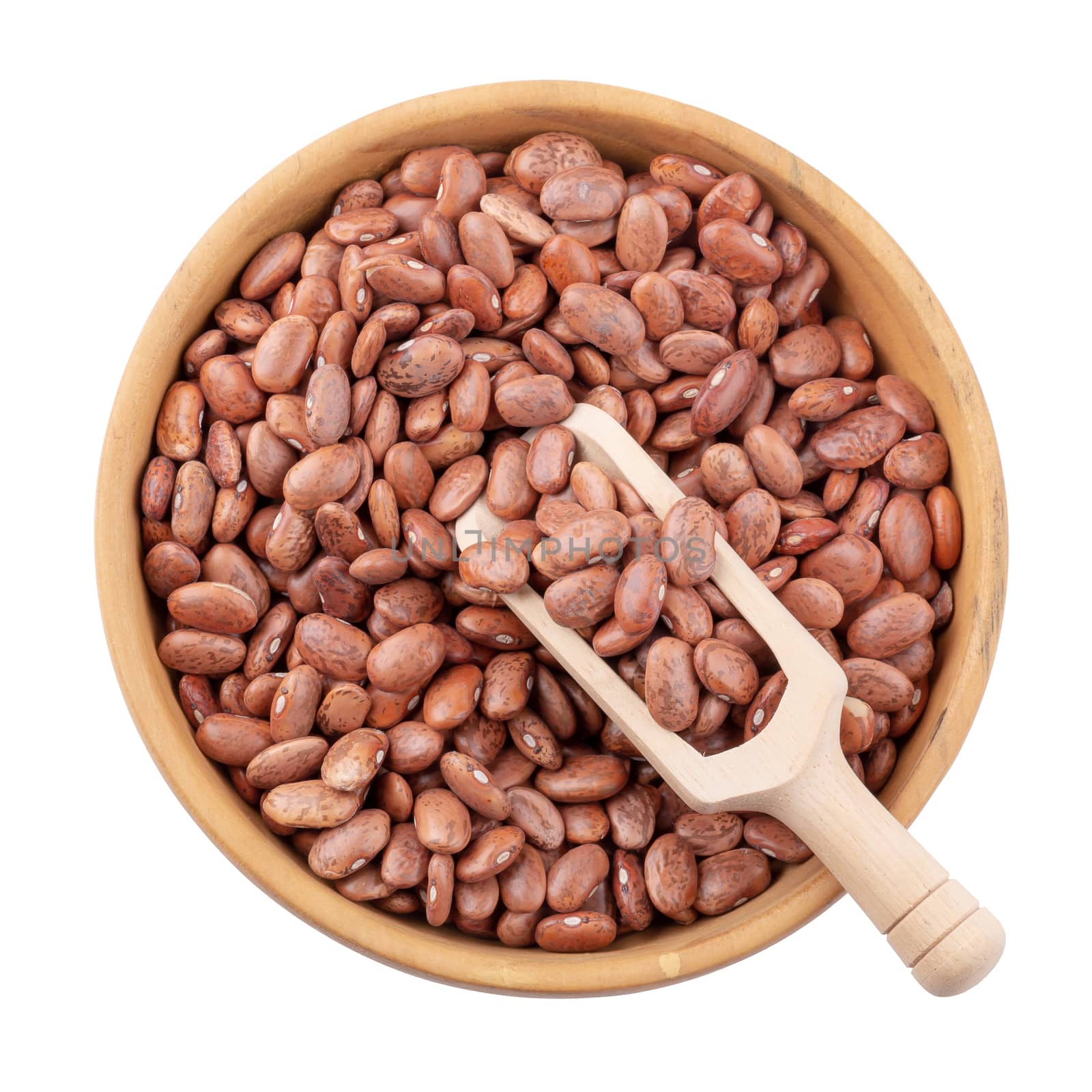 pinto beans in a wooden bowl isolated on a white background.
