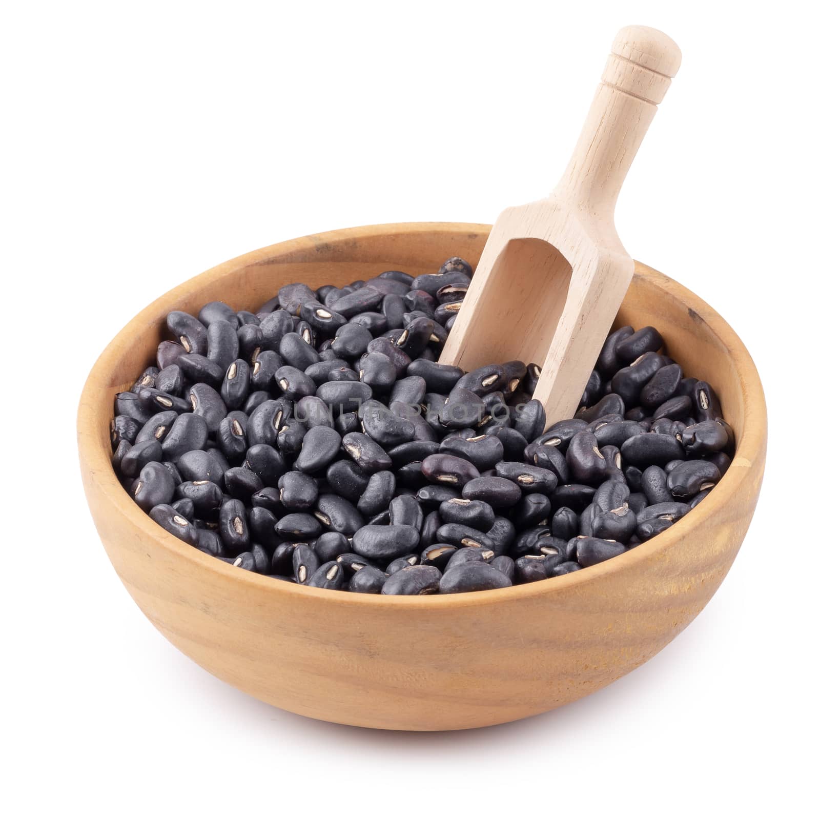 Black bean in a wooden bowl isolated on white background.