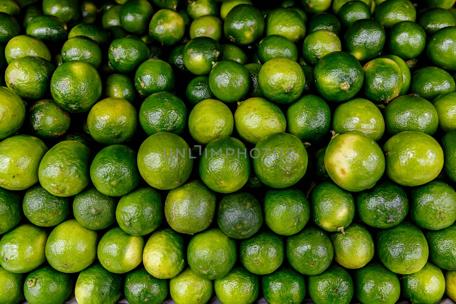 Many limes, top view background. by 9parusnikov