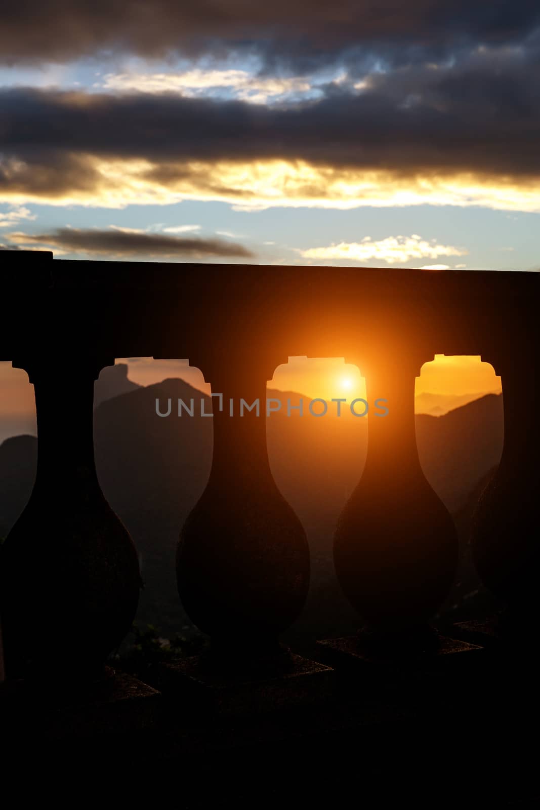 Black silhouette of Balustrade on sunset and mountain line backgound by 9parusnikov