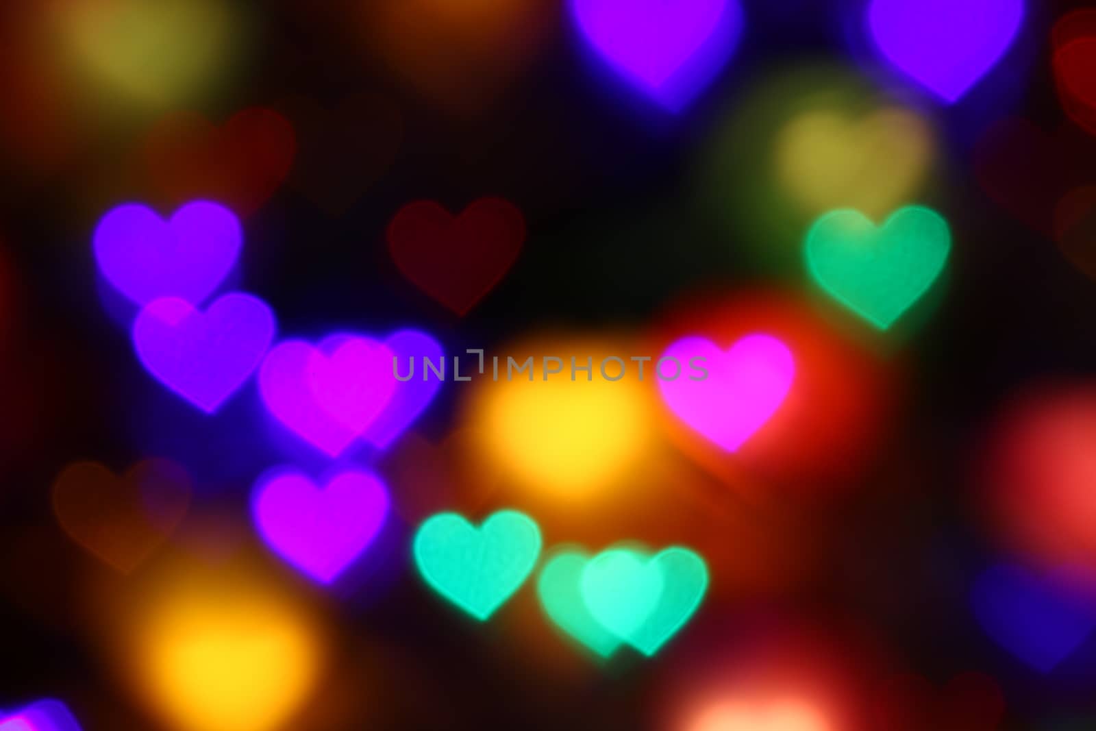 Valentines Colorful heart-shaped bokeh on black background lighting bokeh for decoration at night backdrop wallpaper blur valentine, Love Pictures background, Lighting heart shaped soft night abstract
