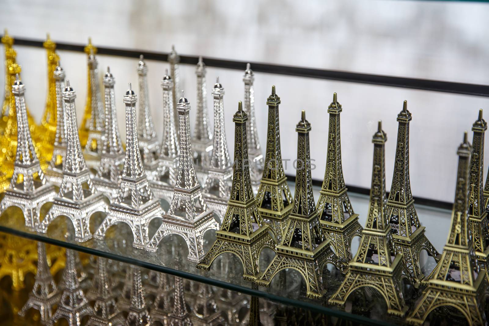 Row of mini Eiffel towers. Souvenir from Paris, France. by 9parusnikov