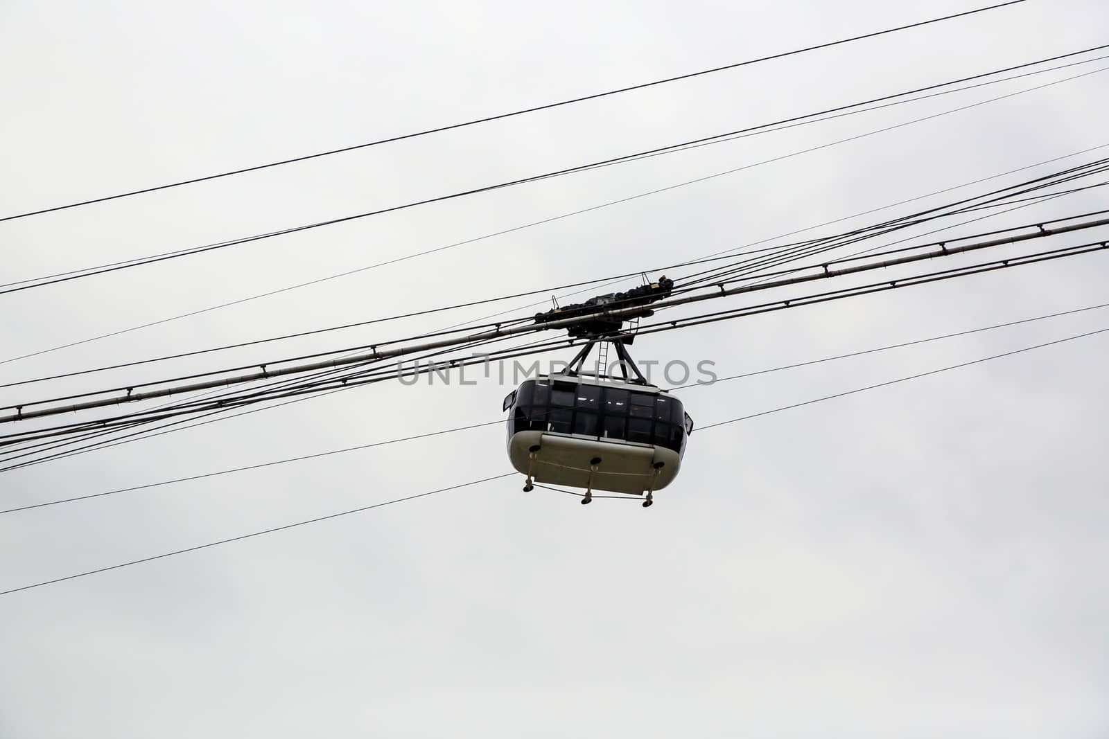 Cabin cableway on a background of cloudy sky