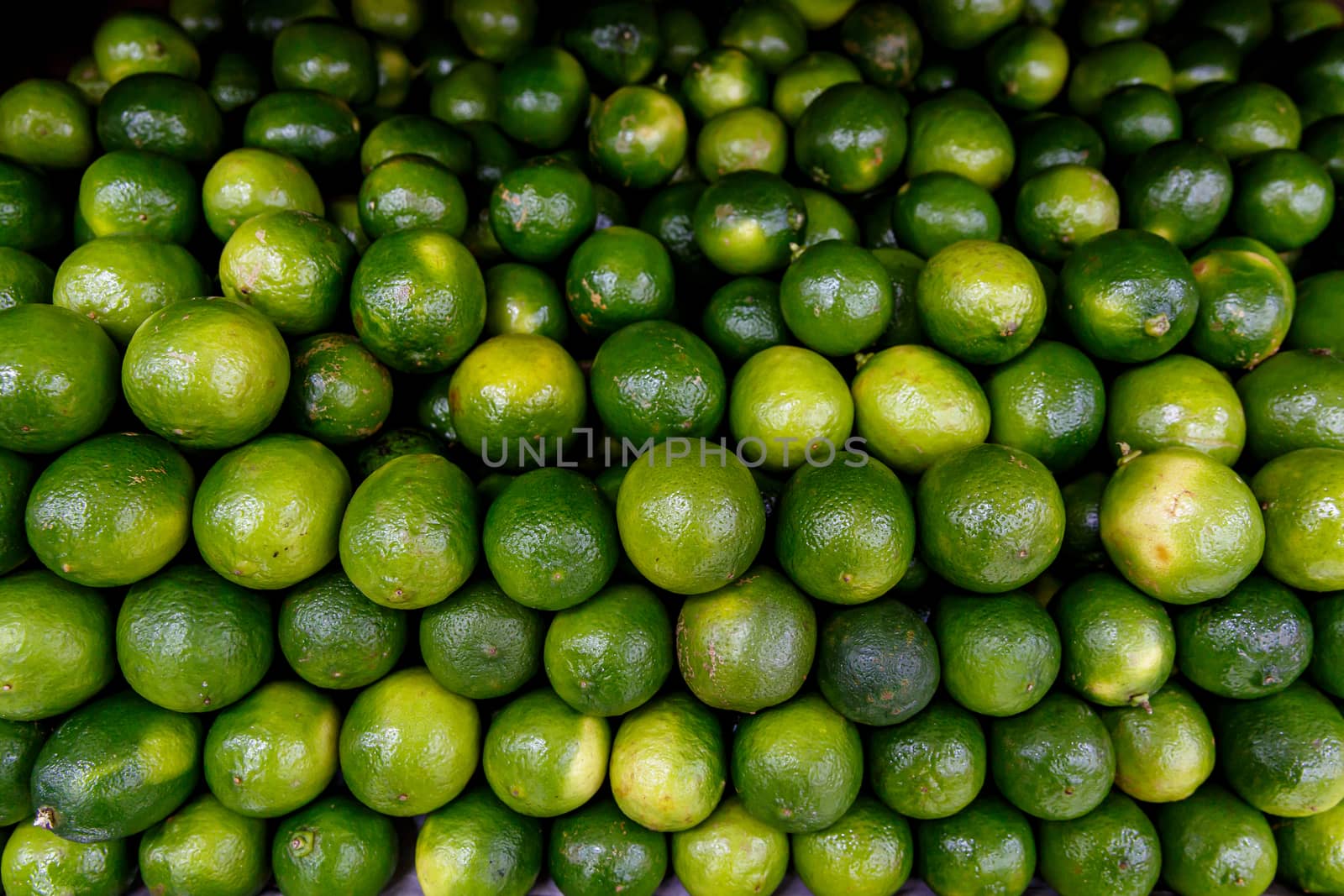 Many limes, top view background. by 9parusnikov