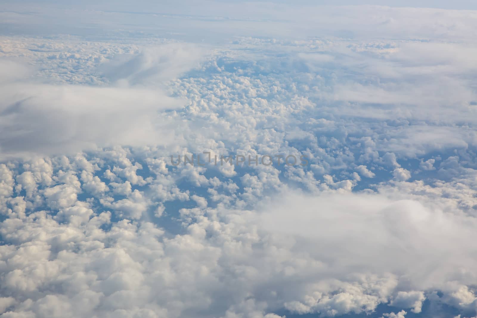 Blue sky from airplane. View above the clouds. by 9parusnikov