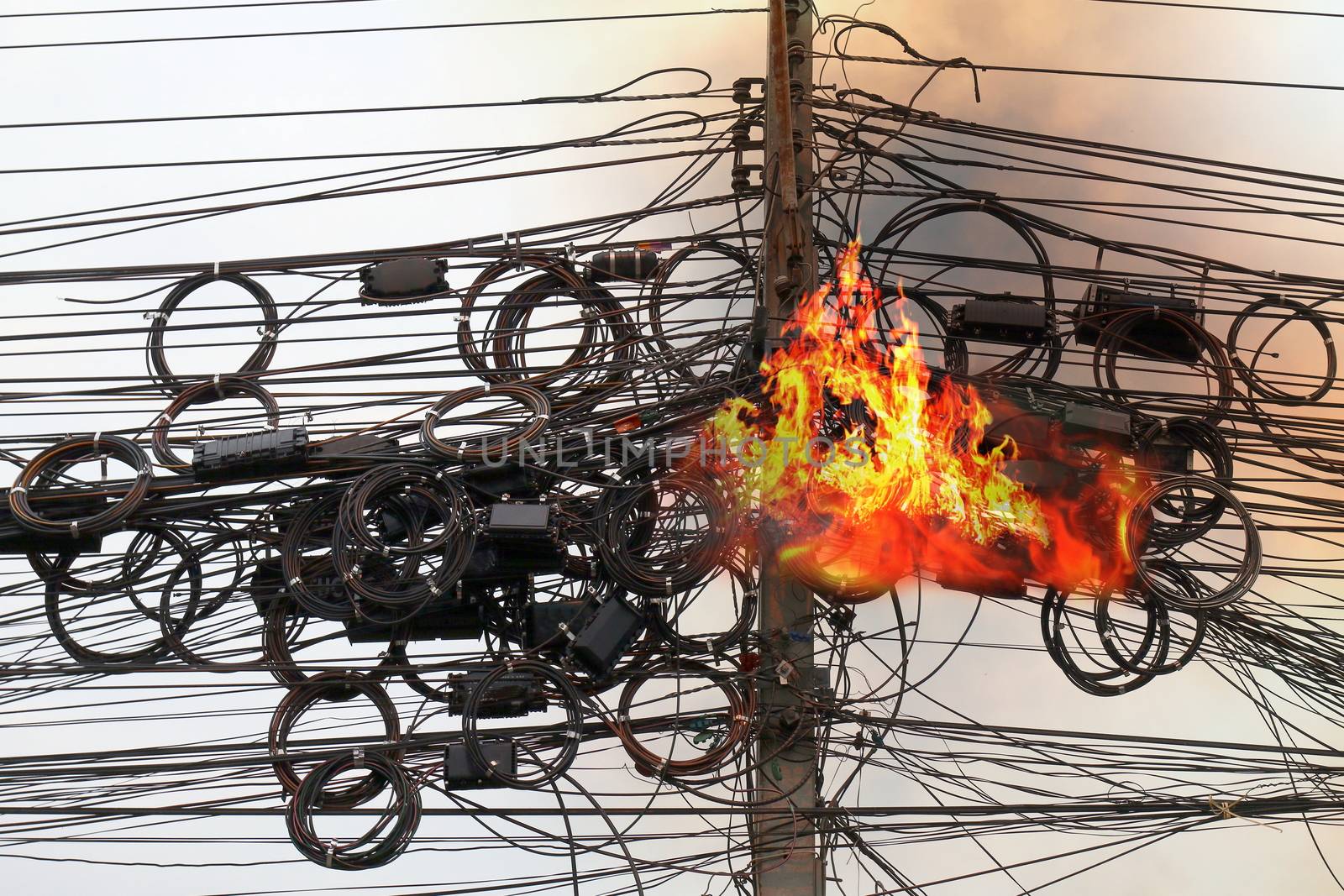 Fire is burning at High Voltage Cables power, Danger wire tangle cord electrical energy