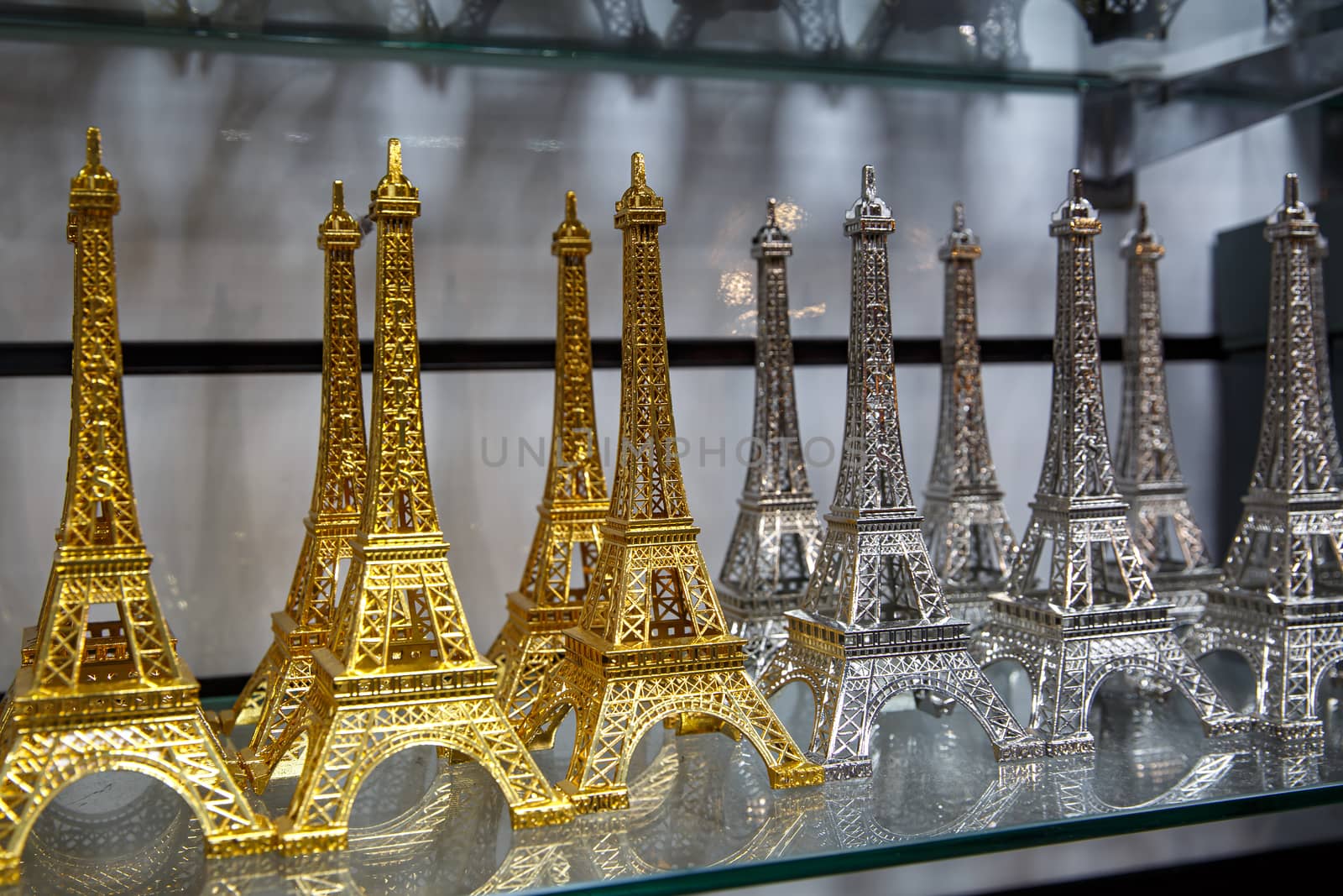 Row of mini Eiffel towers. Souvenir from Paris, France. by 9parusnikov