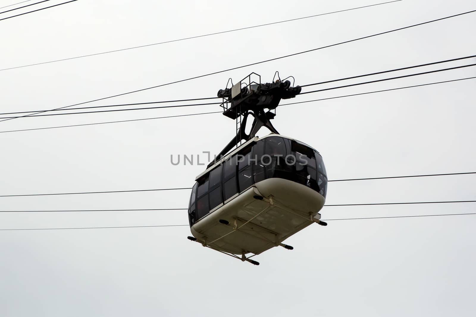 Cabin cableway on a background of cloudy sky