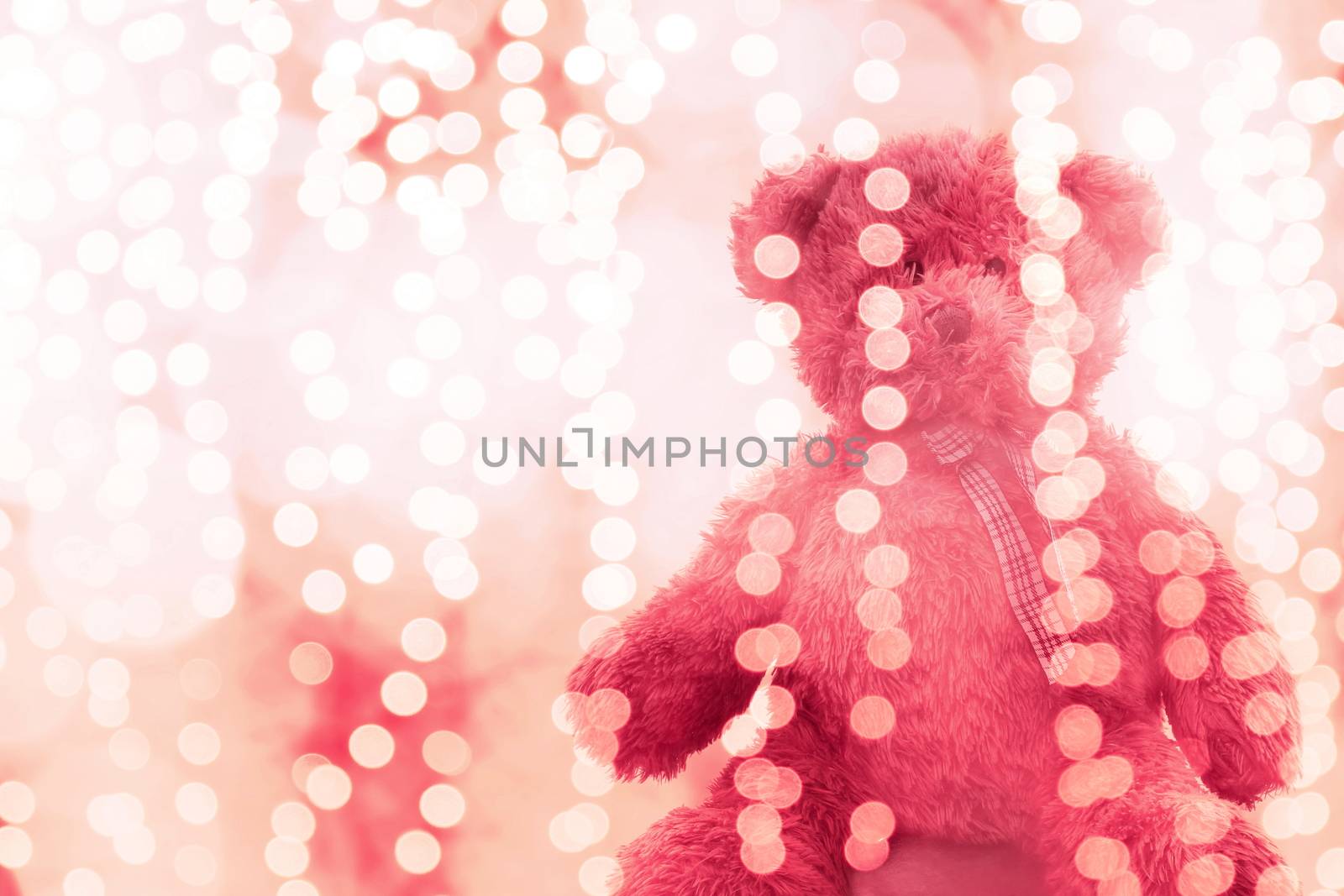 Teddy bear doll in Lighting line bokeh pink bright for Christmas or happy new year Background, Bear Sitting lonely in glitter pink white background Blurred bokeh bright (Selective Focus) by cgdeaw