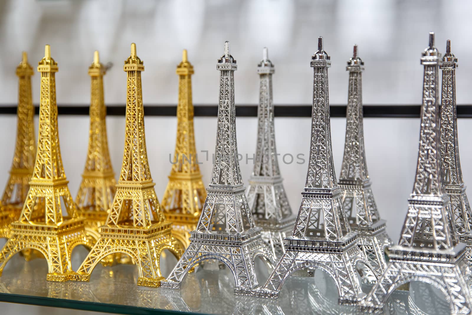 Row of mini Eiffel towers. Souvenir from Paris, France. by 9parusnikov