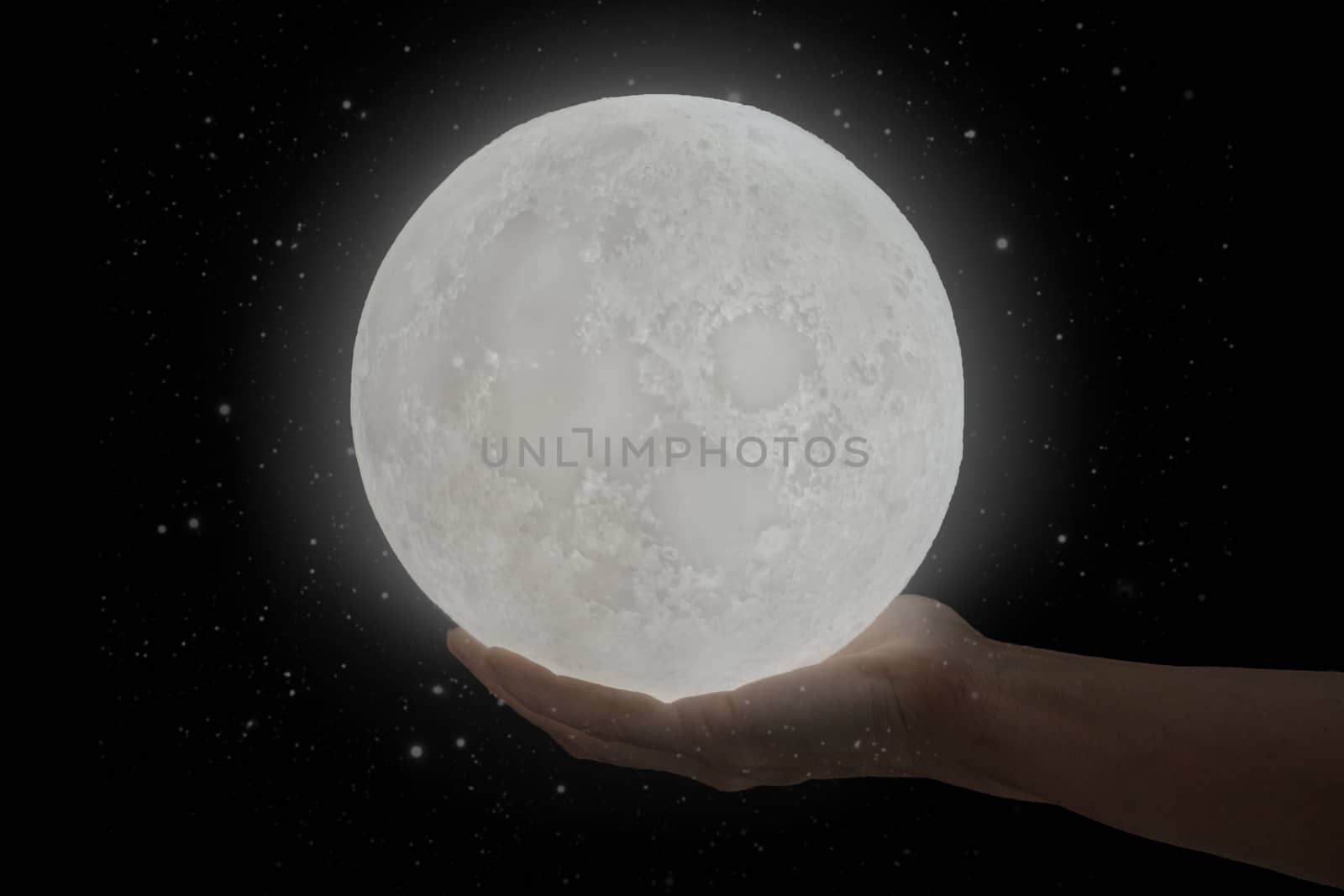 The moon hold by a human hand. by maramade