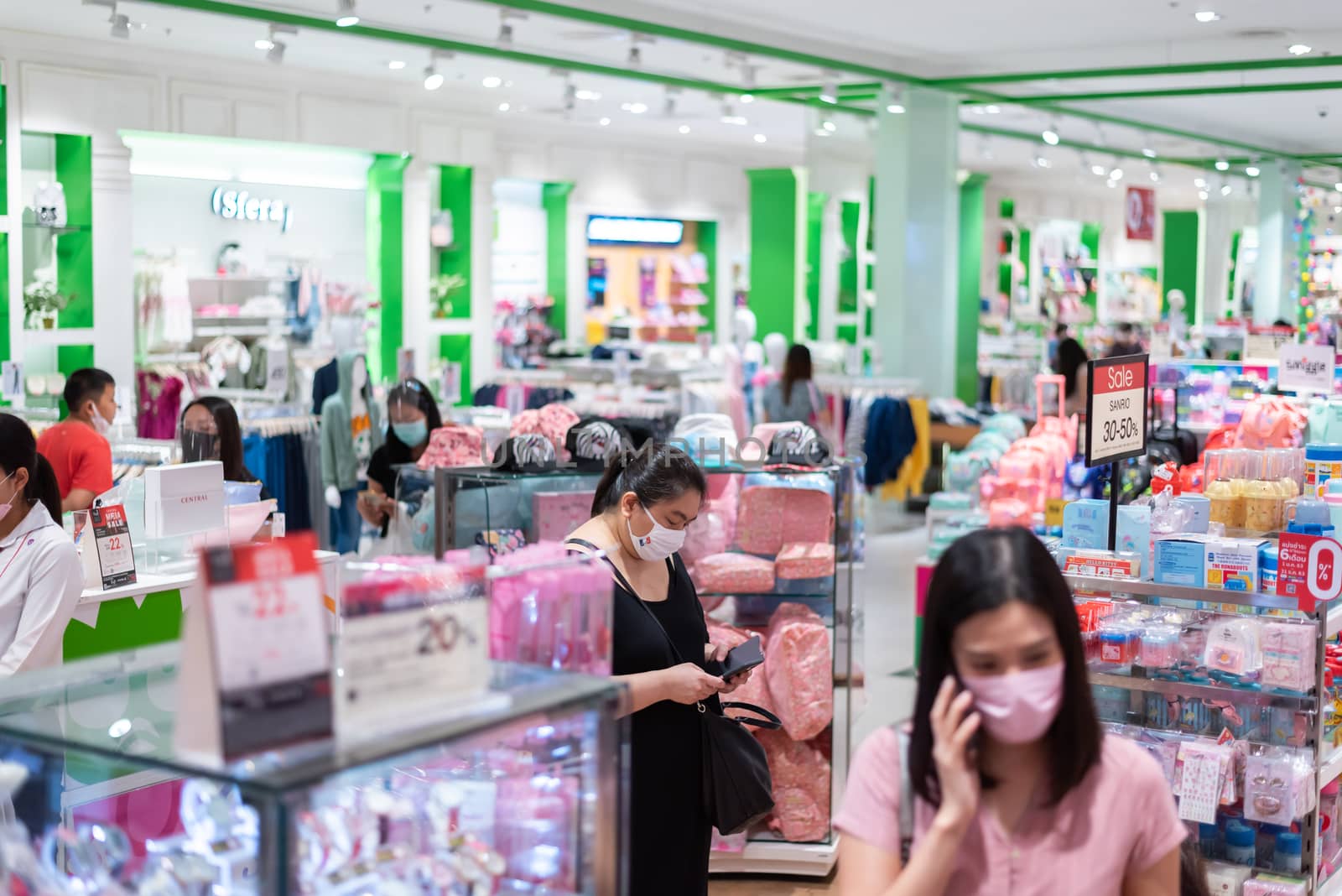 Editorial: Central Bangna Bangkok City, Thailand, 6th Jun 2020. Asian people shopping in the clothing store after opening lockdown with mask and social distancing.