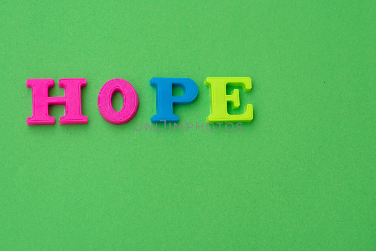 Hope spelled out against green background by rushay