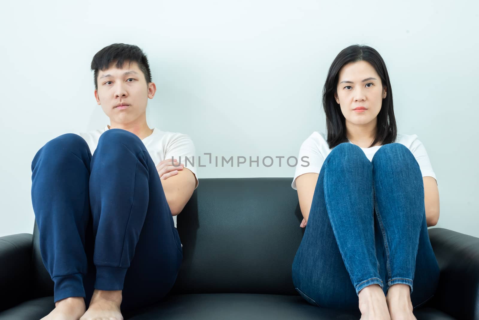 An Asian couple stays together with boring and social distancing.