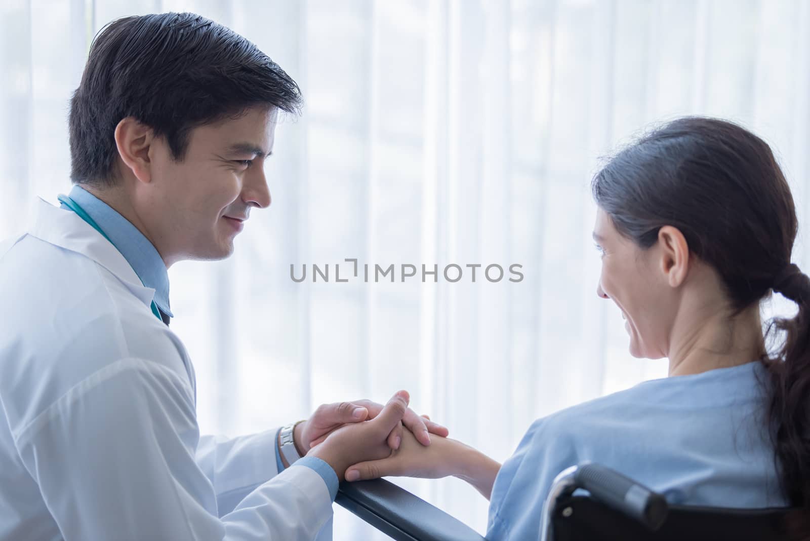 A doctor take care of sick patient woman at the hospital or medical clinic.