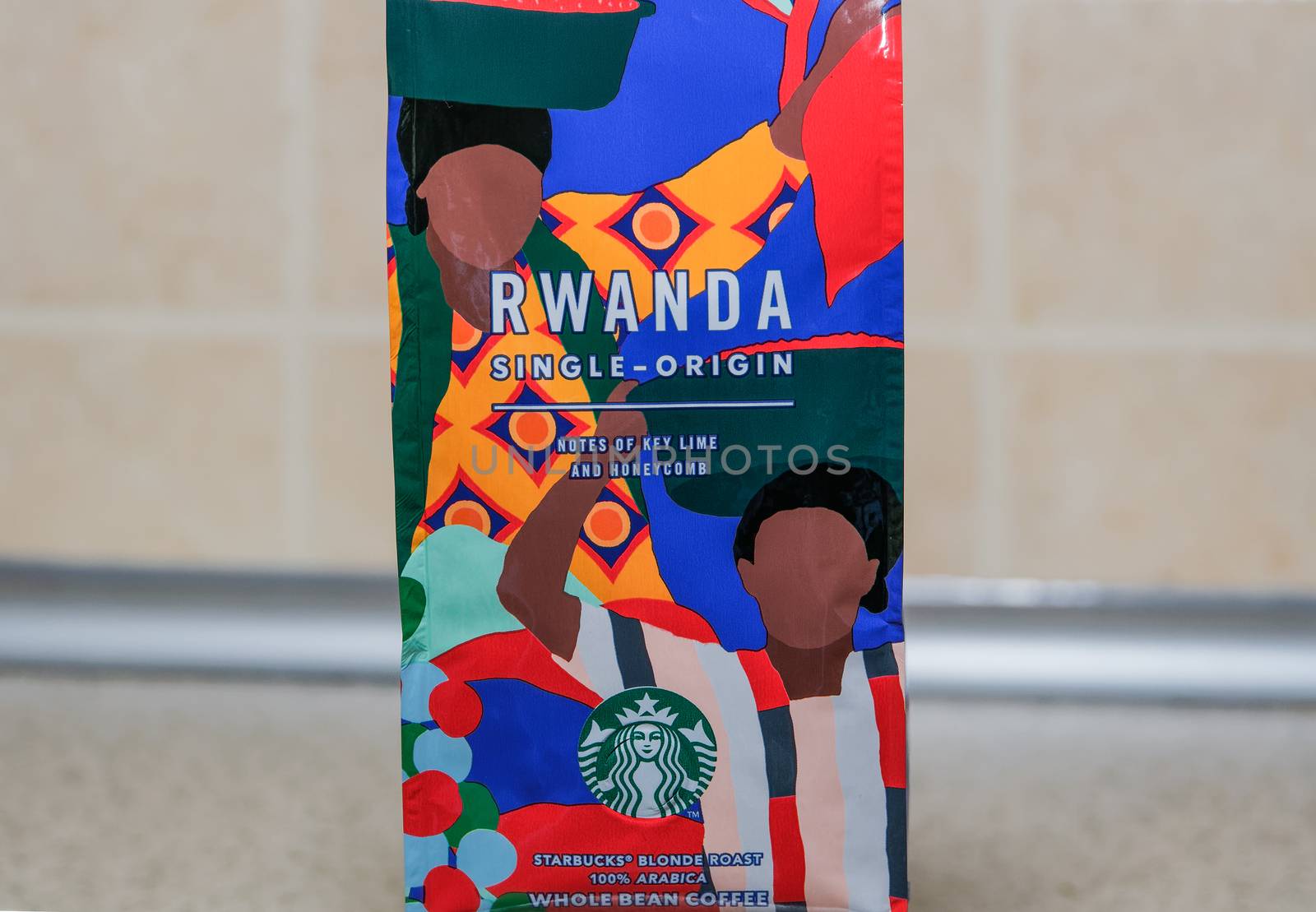 Seasonal beverage Rwanda coffee bag with green & white siren company logo.