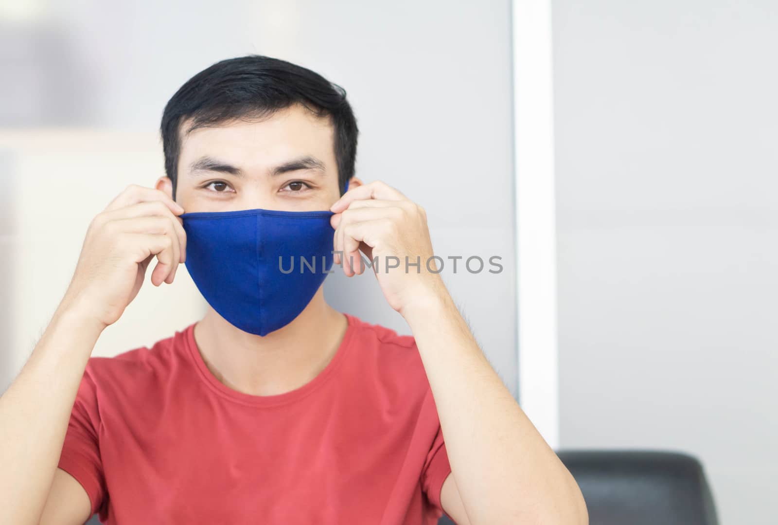 Closeup asian man wearing face mask for protect air polution or  by pt.pongsak@gmail.com