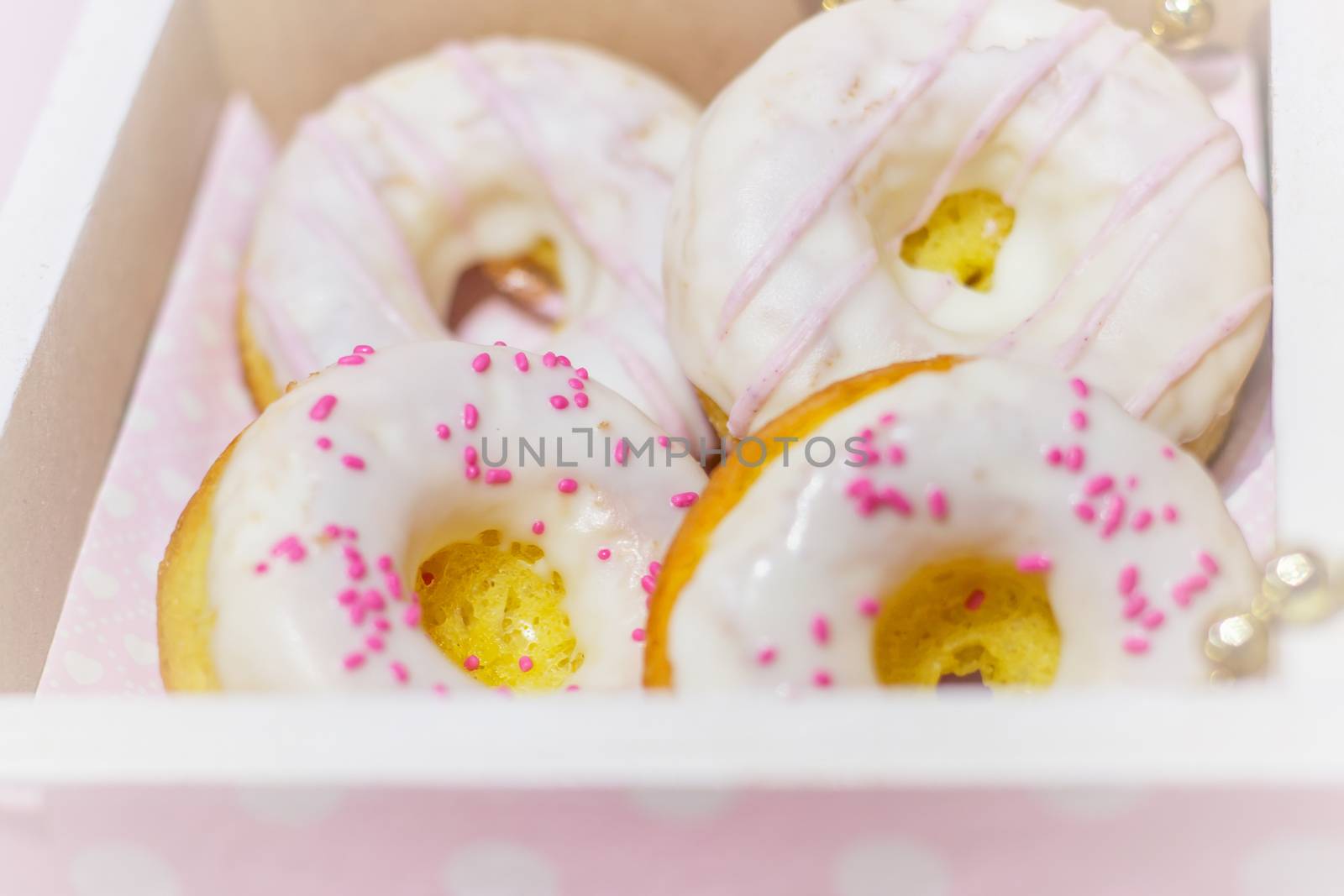 White icing doughnuts in decorated  gift box