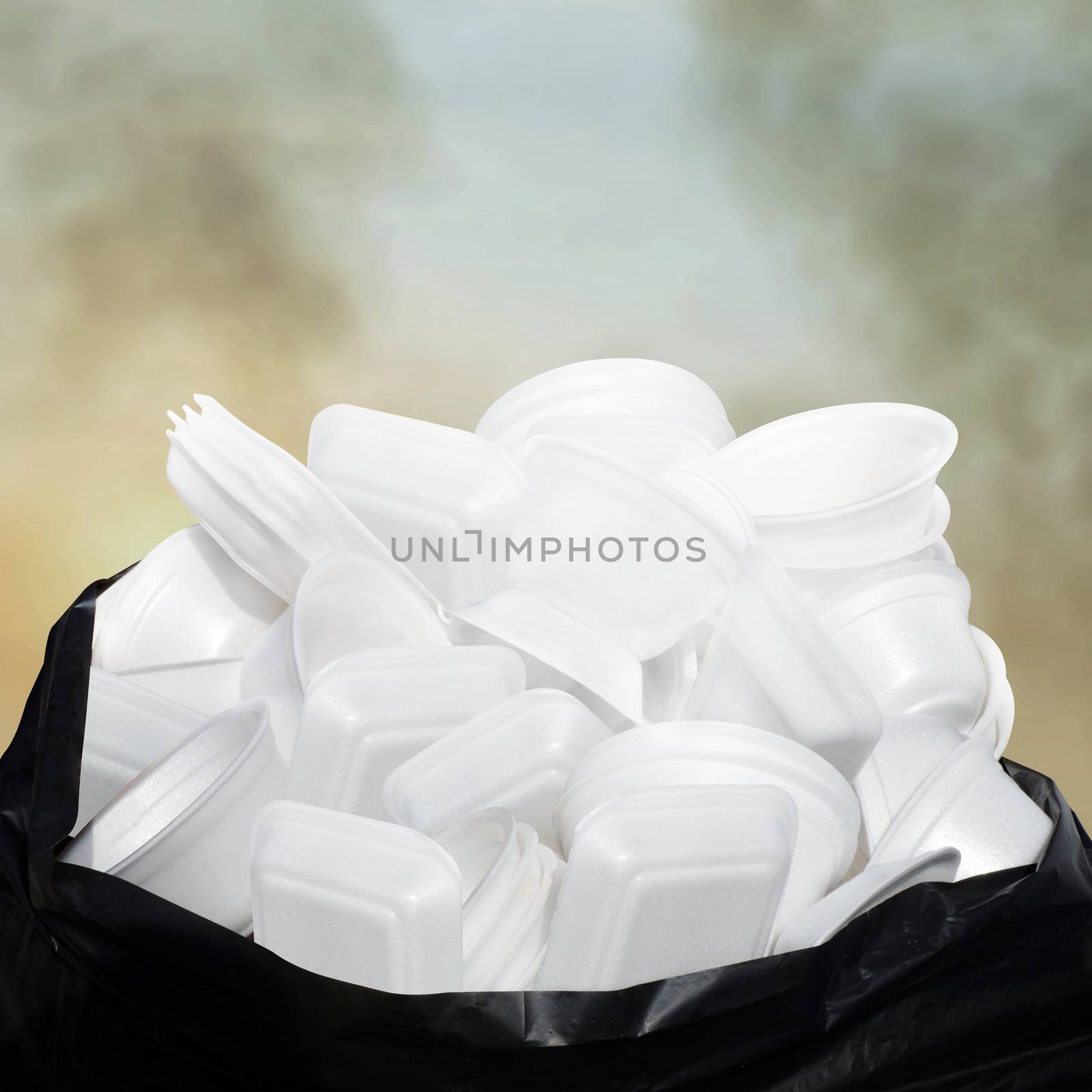 Waste Garbage foam food tray white many pile on the plastic black bag dirty on sky cloud air atmosphere pollution background