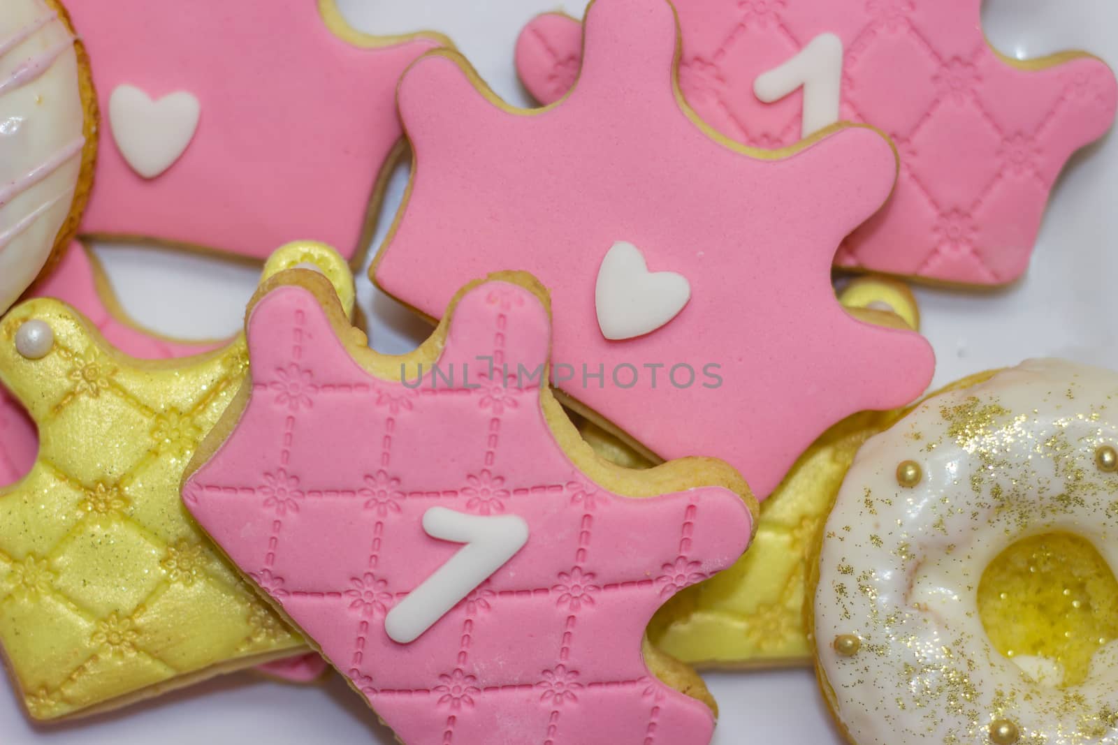 First birthday royal icing cookies - pink and golden crown shaped cookies with number 1