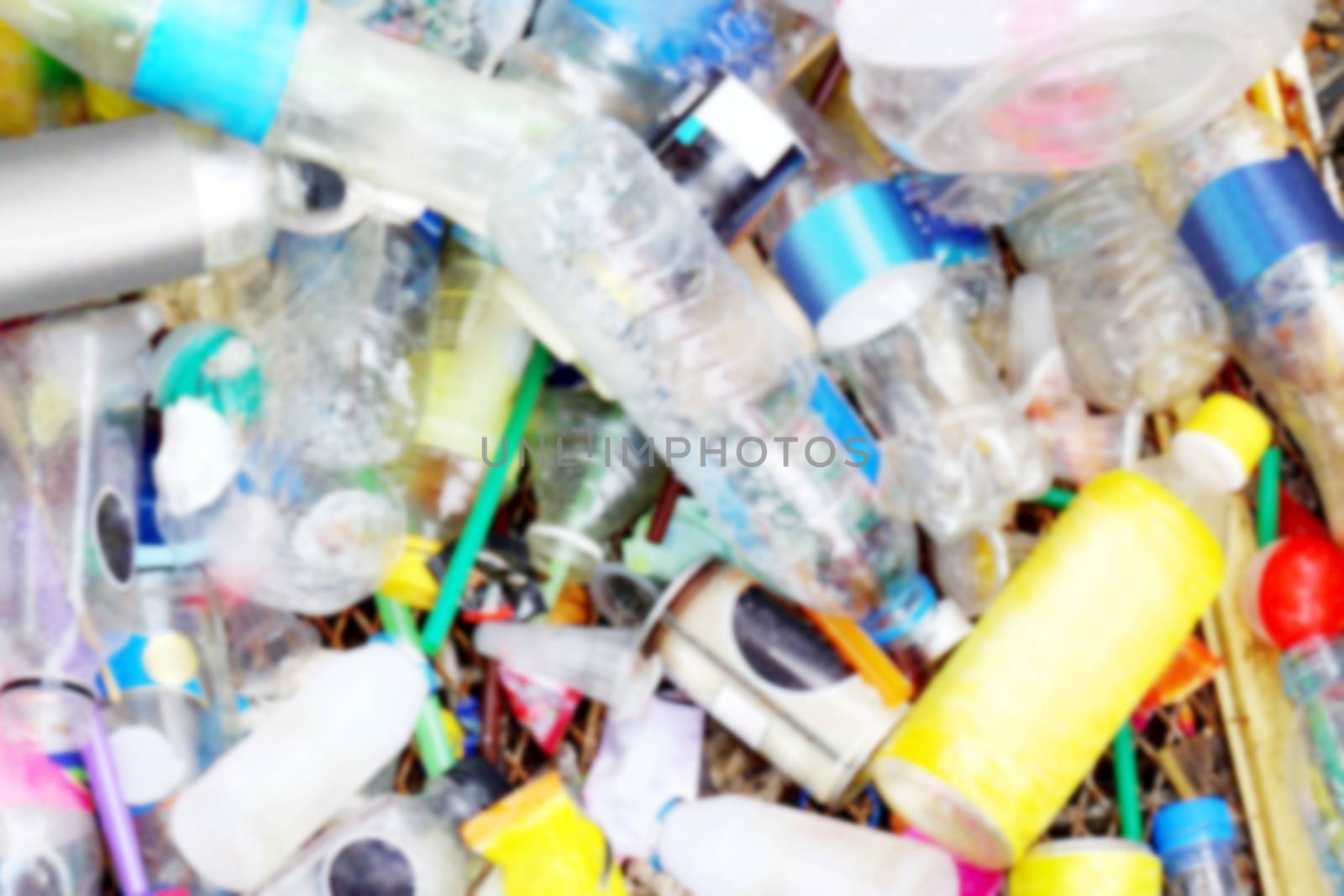 blurred waste garbage plastic bottle background, plastic waste texture blur by cgdeaw