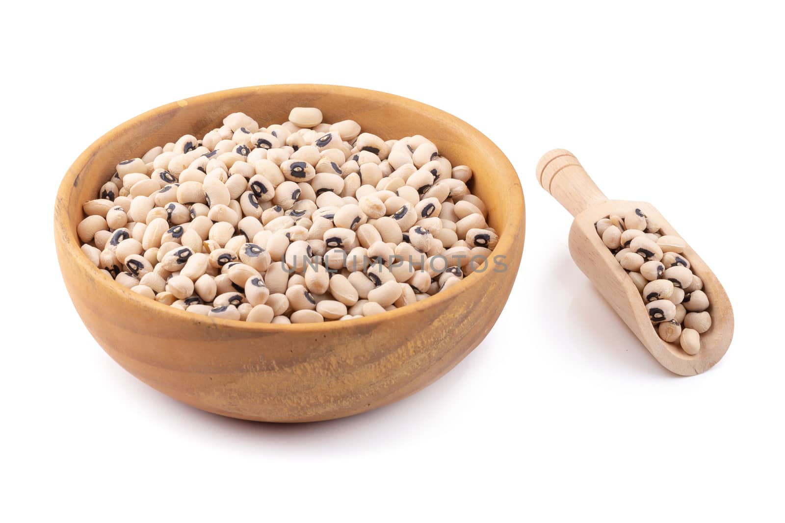 Black-eyed peas in a wooden bowl isolated on a white background by kaiskynet