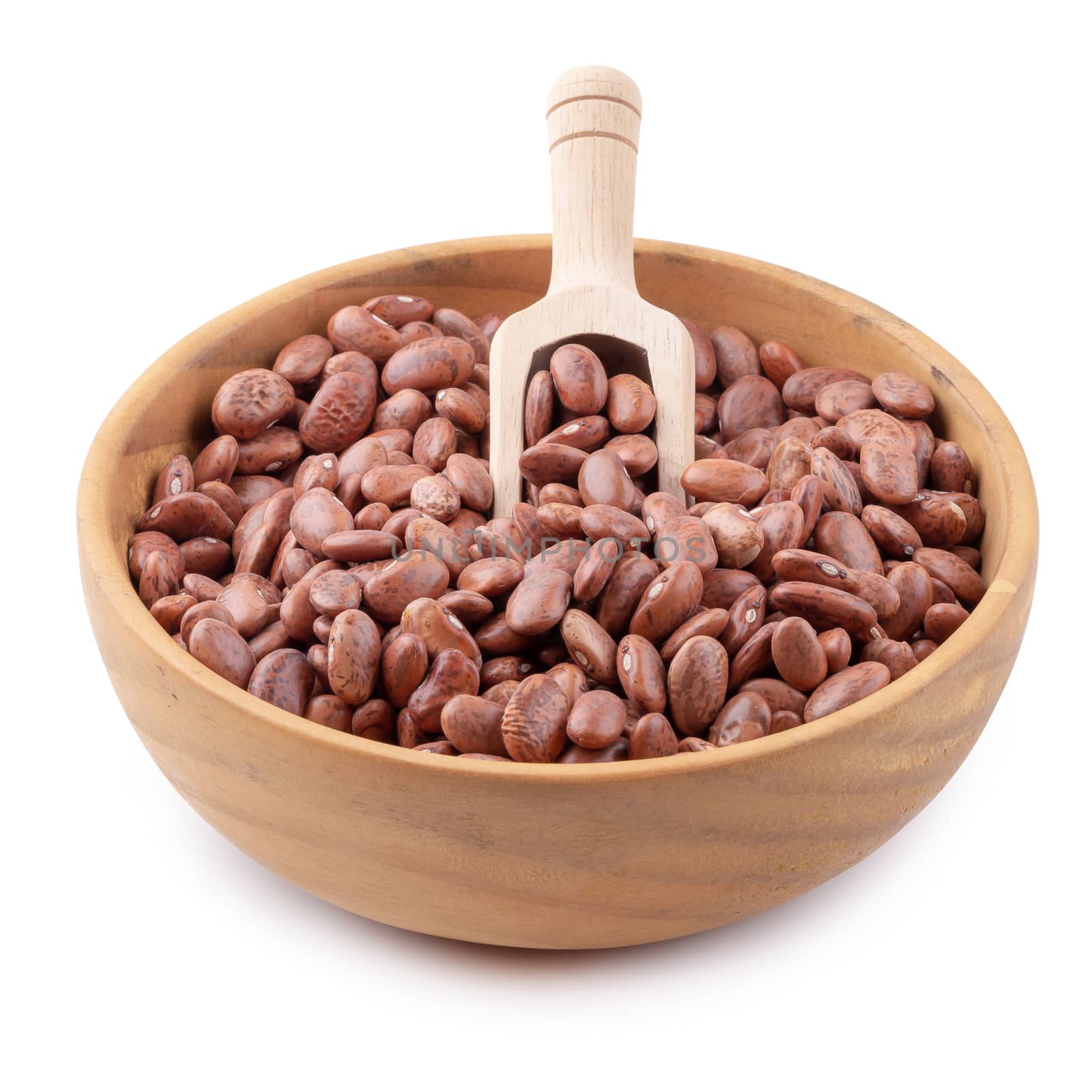 pinto beans in a wooden bowl isolated on a white background by kaiskynet