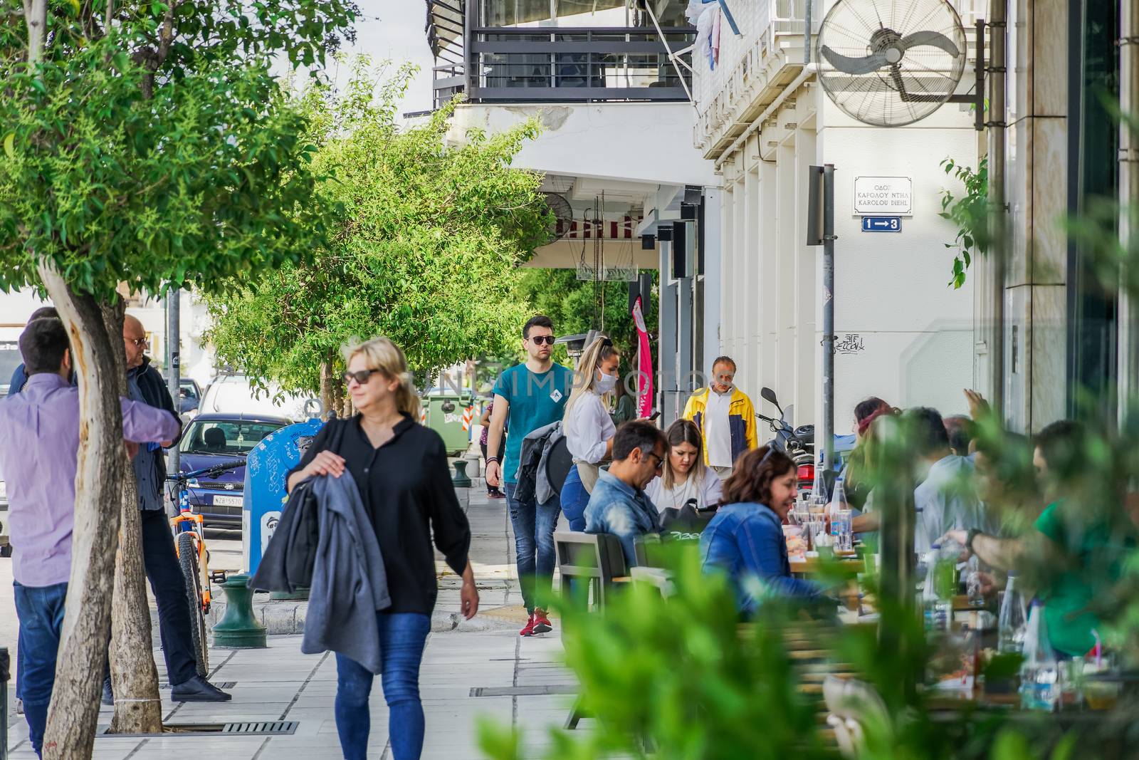 Thessaloniki, Greece - May 25 2020: Bars open for the first day for the summer. Crowd sitting on bar restaurants at the city center, after Hellenic government loosens COVID-19 coronavirus measures.