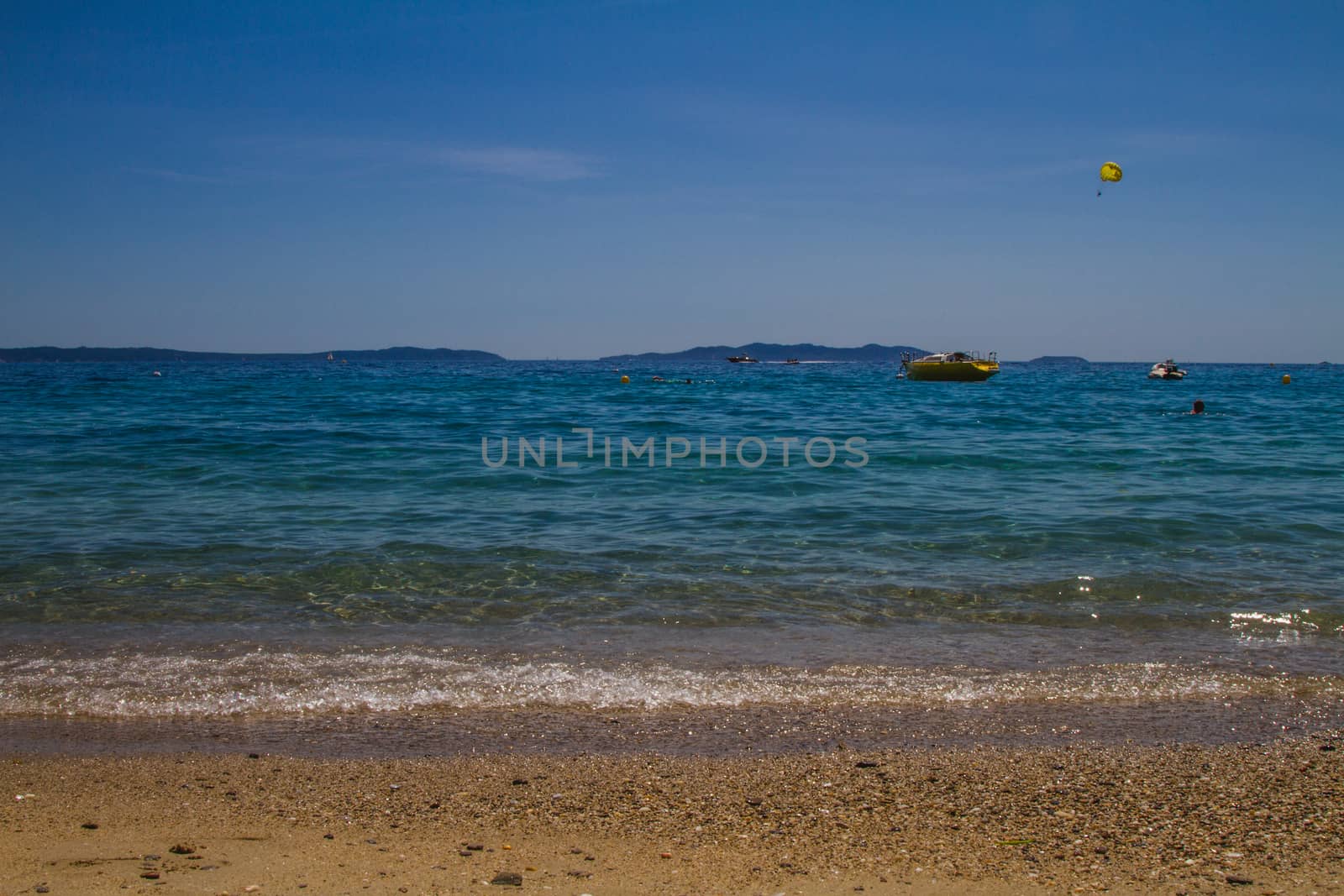 A series of water sports taking place at the beach on a holiday