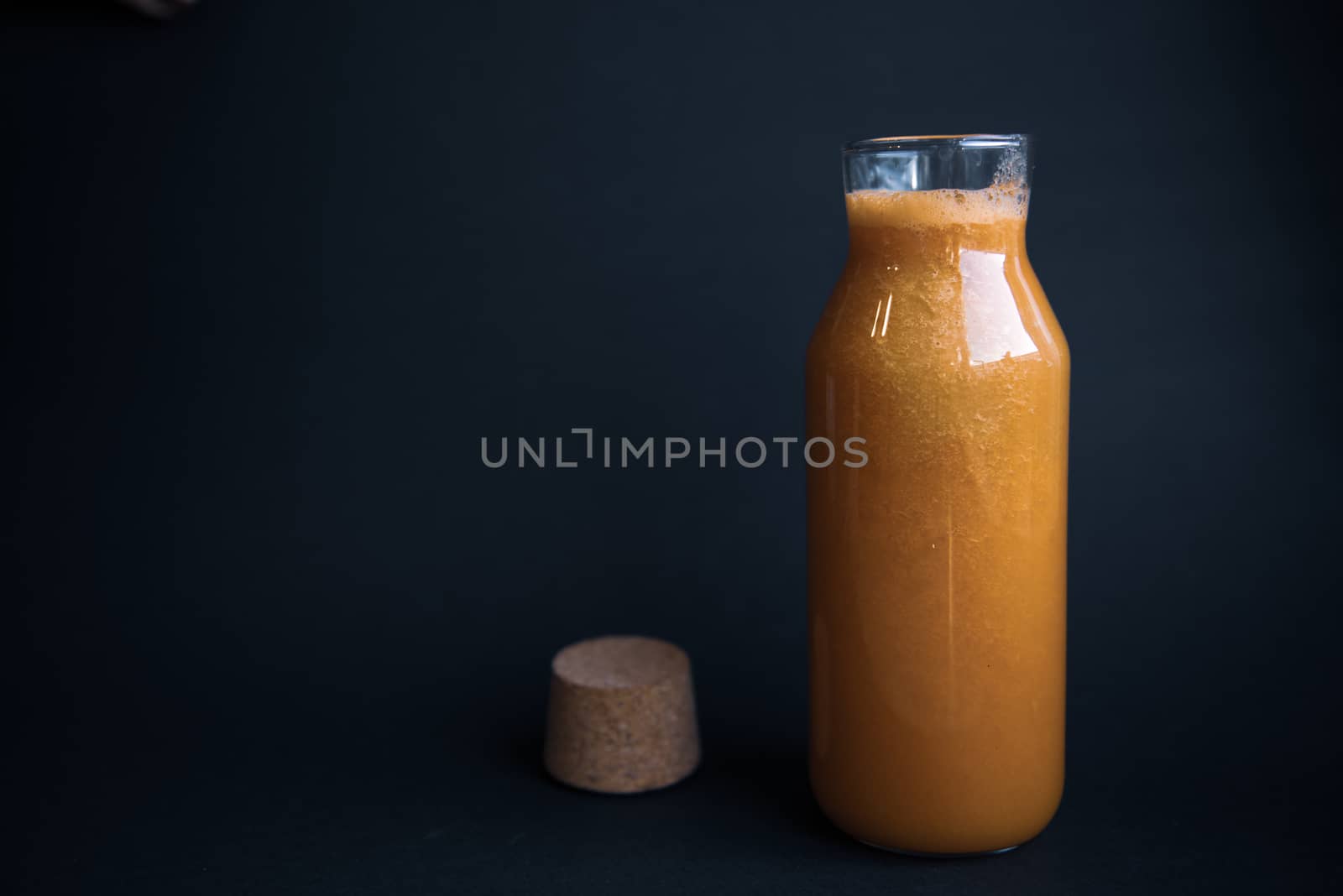 Healthy lifestyle. A close-up of a vegetarian fresh raw detox vegetable juice. Healthy Eating, Diet and Lifestyle Concept. The concept of beauty. Fresh juice in a retro glass jar on dark background with place for text